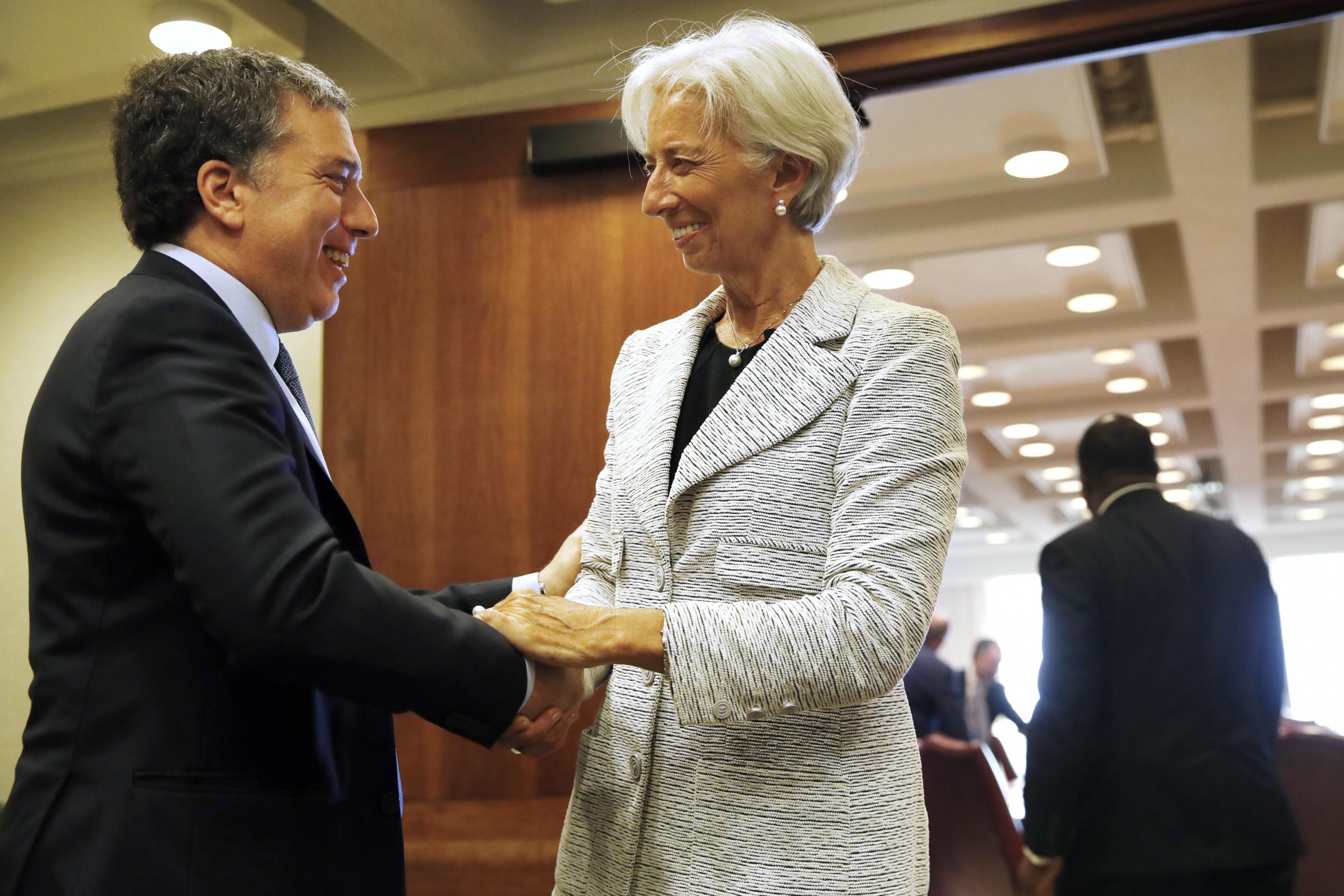 Christine Lagarde, right, meets with Argentina's Treasury Minister Nicolas Dujovne, at the IMF in Washington. AP Photo/Jacquelyn Martin