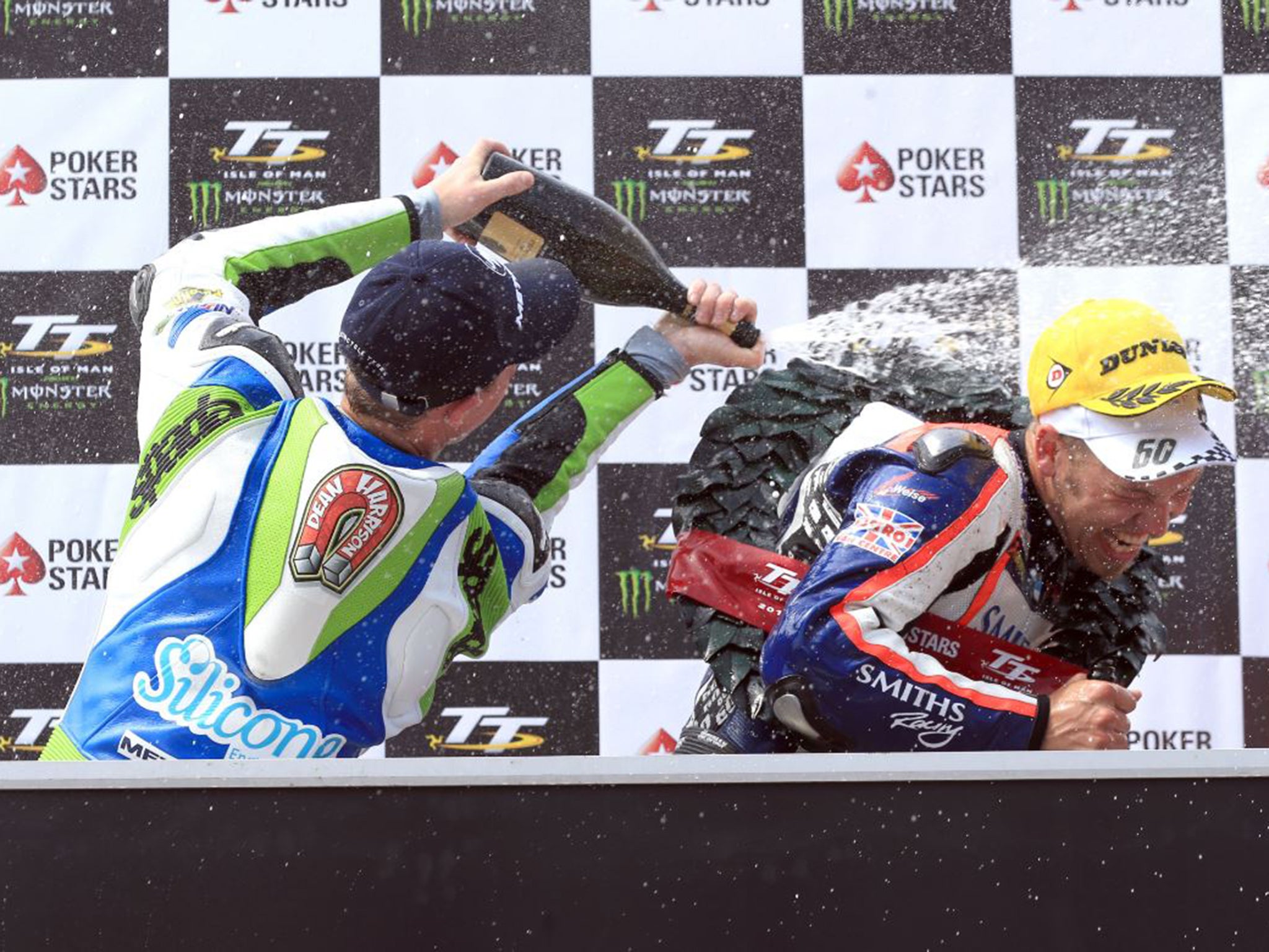 Dean Harrison sprays Peter Hickman with champagne after the Senior TT