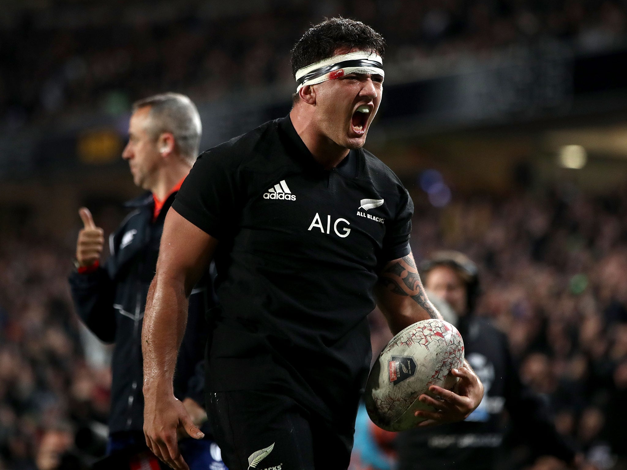 Codie Taylor celebrates after scoring a try