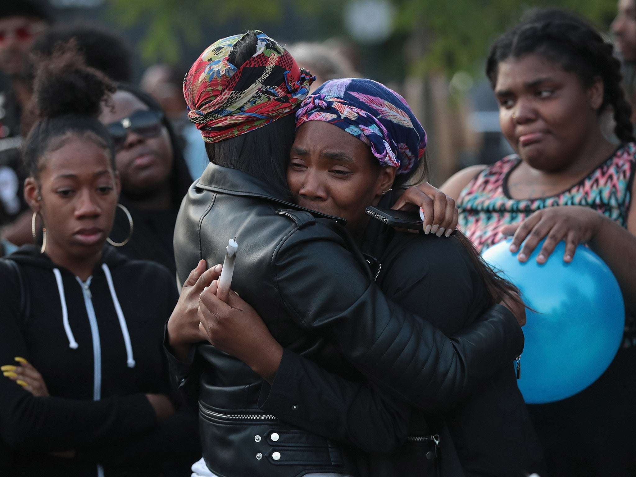 Family, friends and supporters gather in the Bronzeville neighborhood for a vigil to honor 24 year old Maurice Granton Jr. on June 7, 2018