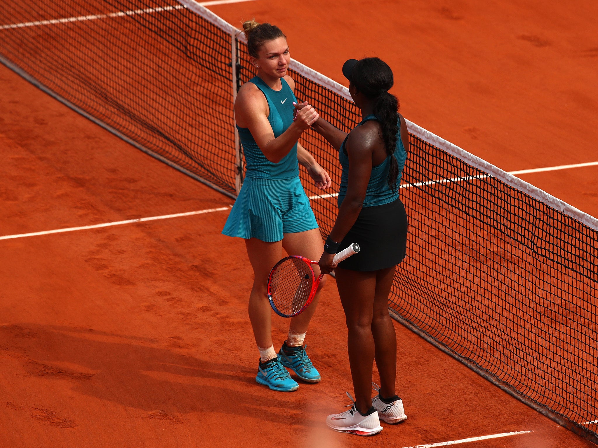 Halep with Sloane Stephens after securing victory on Saturday