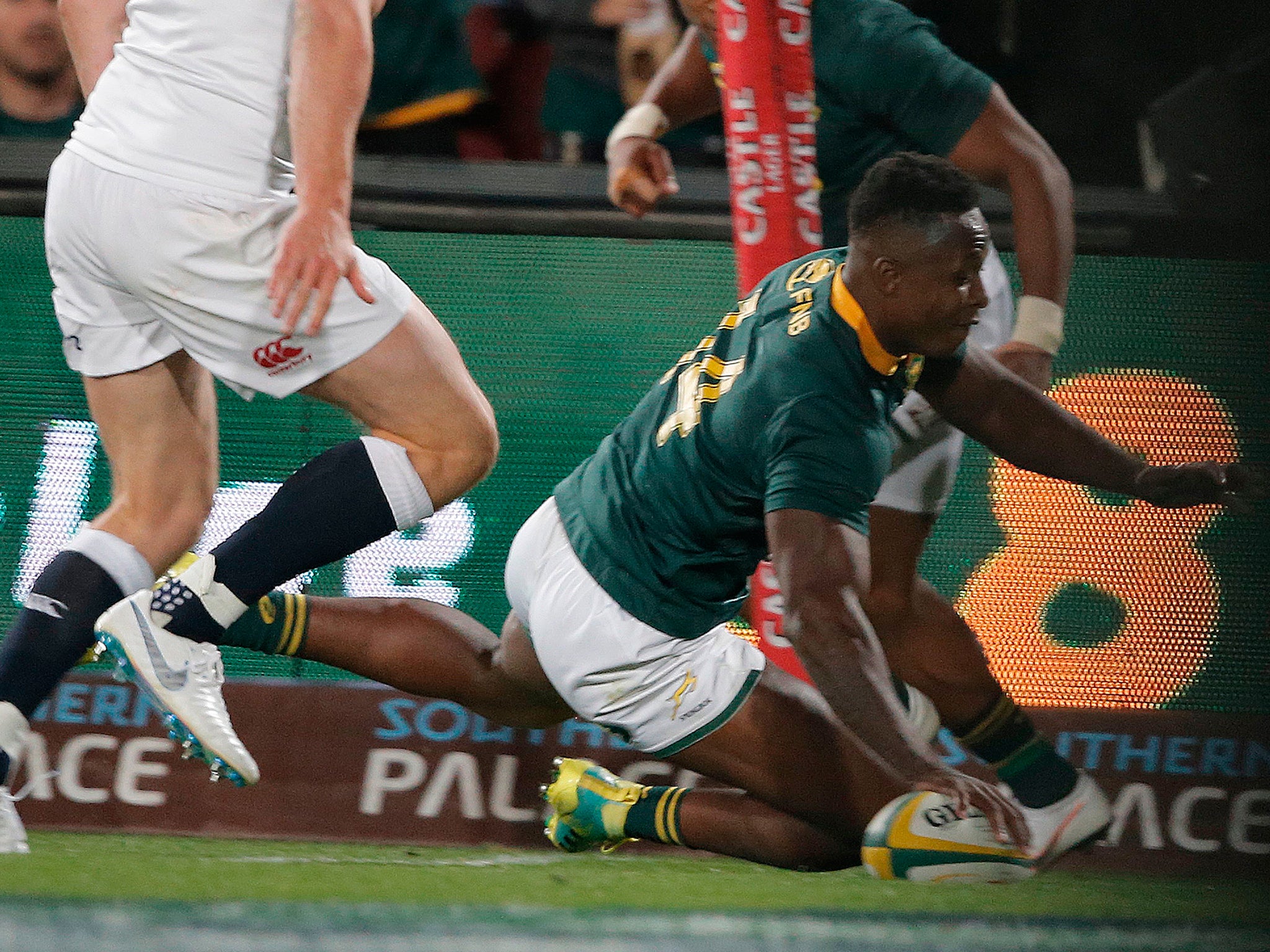 S'Busiso Nkosi scores one of his two tries against England