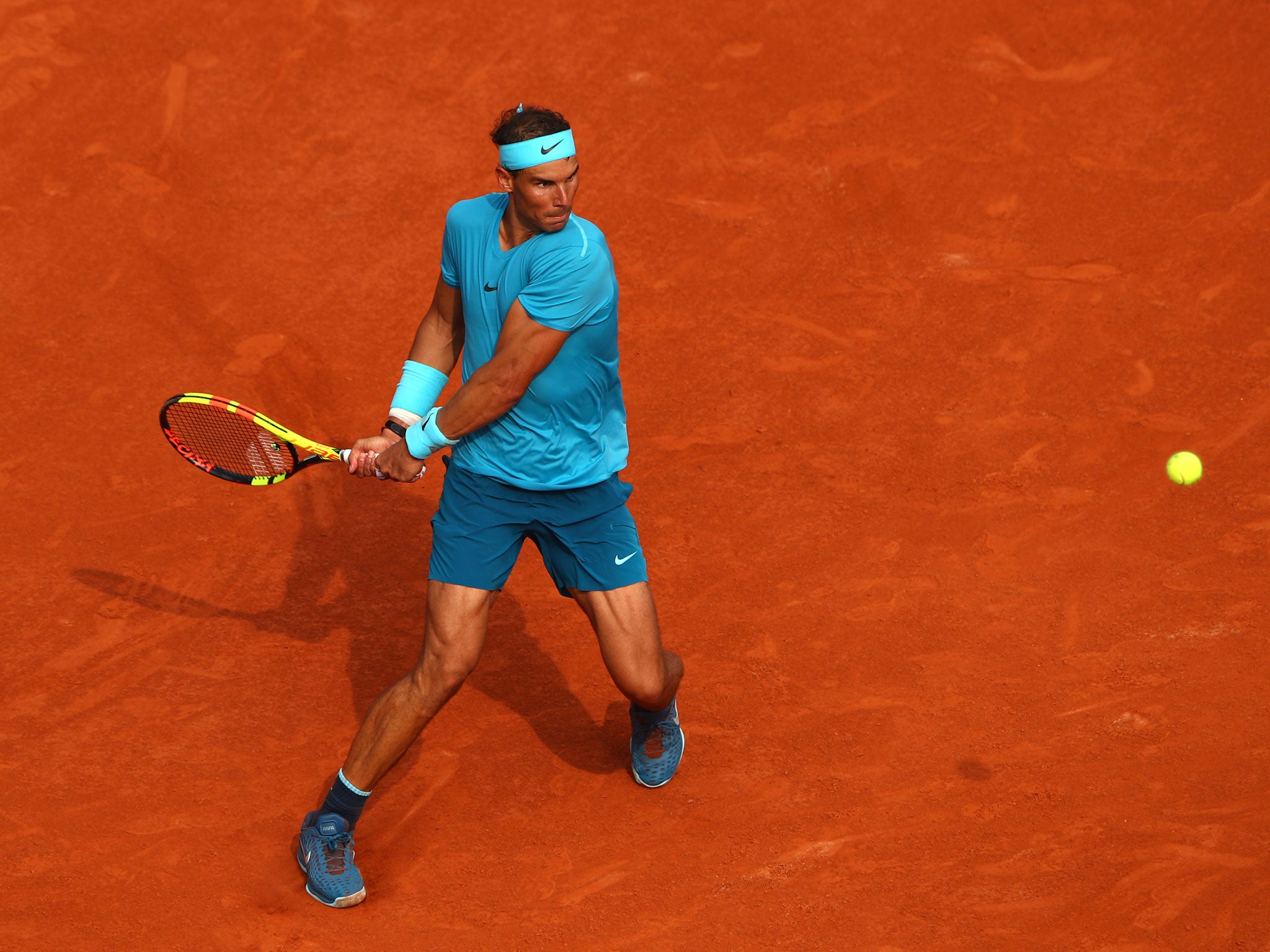 Nadal lines up for a backhand shot during the third set