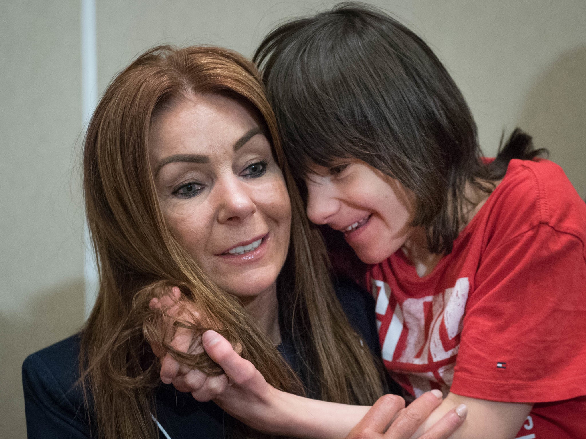 Charlotte Caldwell and her son Billy at Heathrow Airport