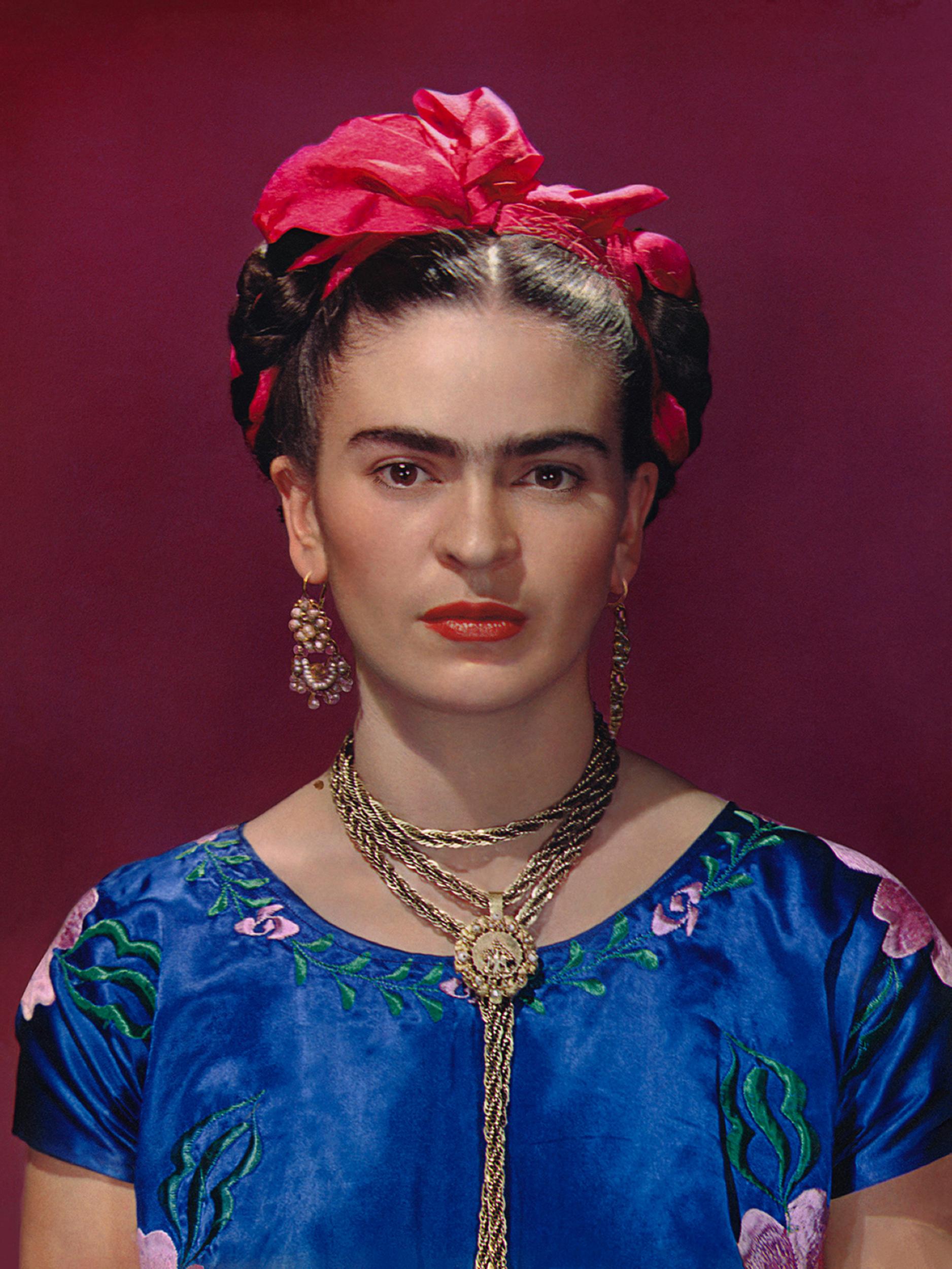 Frida Kahlo in blue satin blouse, 1939, photograph by Nickolas Muray