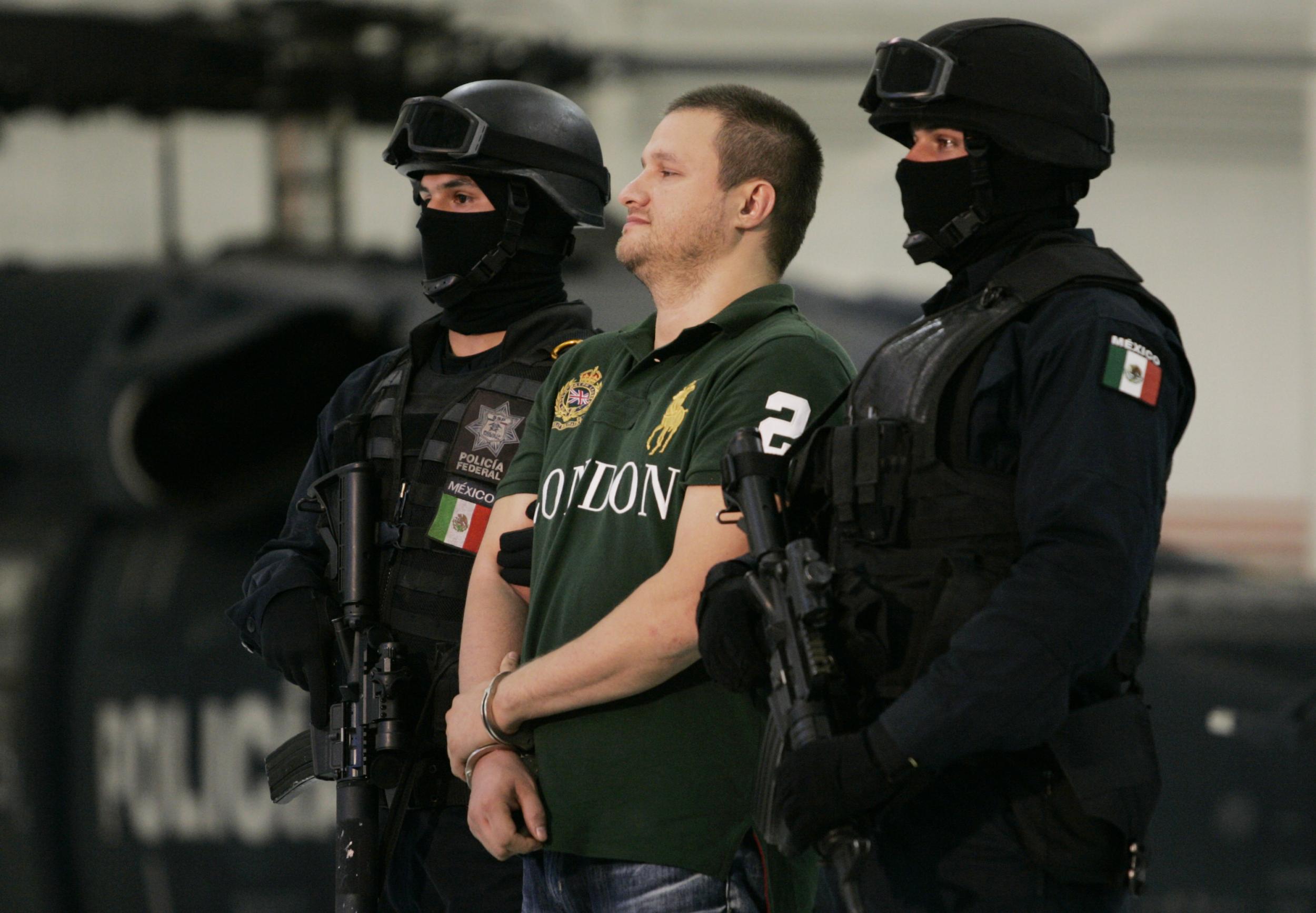 Edgar 'La Barbie' Valdez Villarreal is shown to the press during a news conference at the federal police center August 31, 2010 in Mexico City