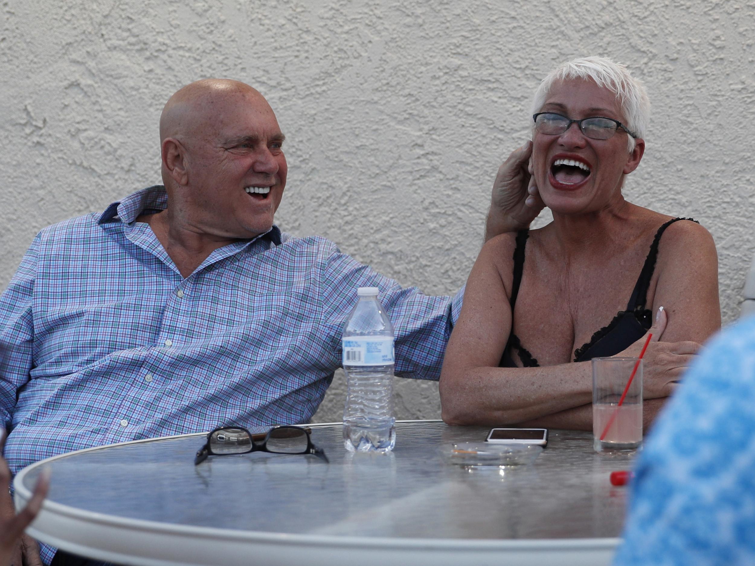 Dennis Hof, left, jokes with madam Sonja Bandolik in at the Love Ranch brothel in Crystal, Nevada, in April