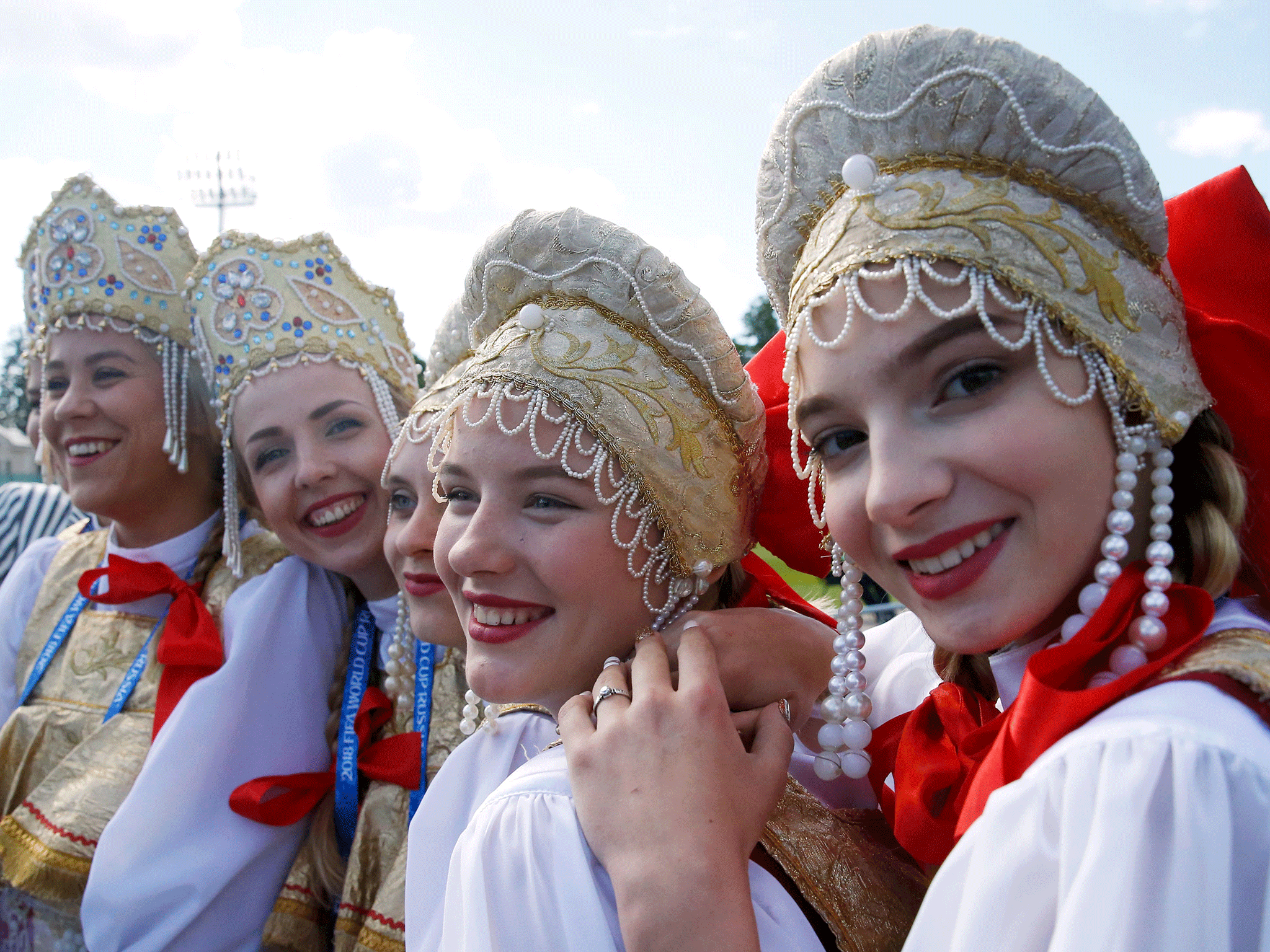 Women in traditional Russian clothing ahead the training session at the Spartak Zelenogorsk Stadium, Repino
