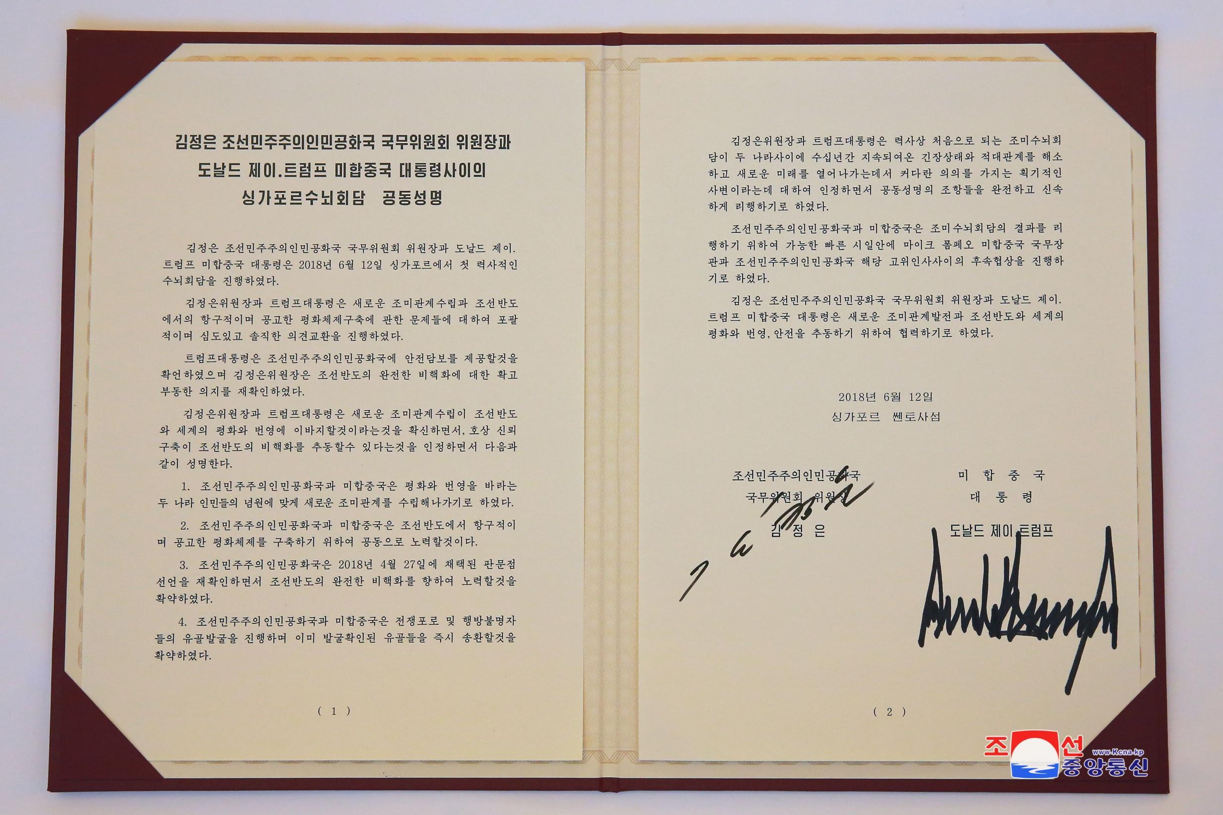 A photo released by the official North Korean Central News Agency (KCNA) shows agreement signed by Kim Jong-Un and Donald Trump in Singapore 12 June 2018.