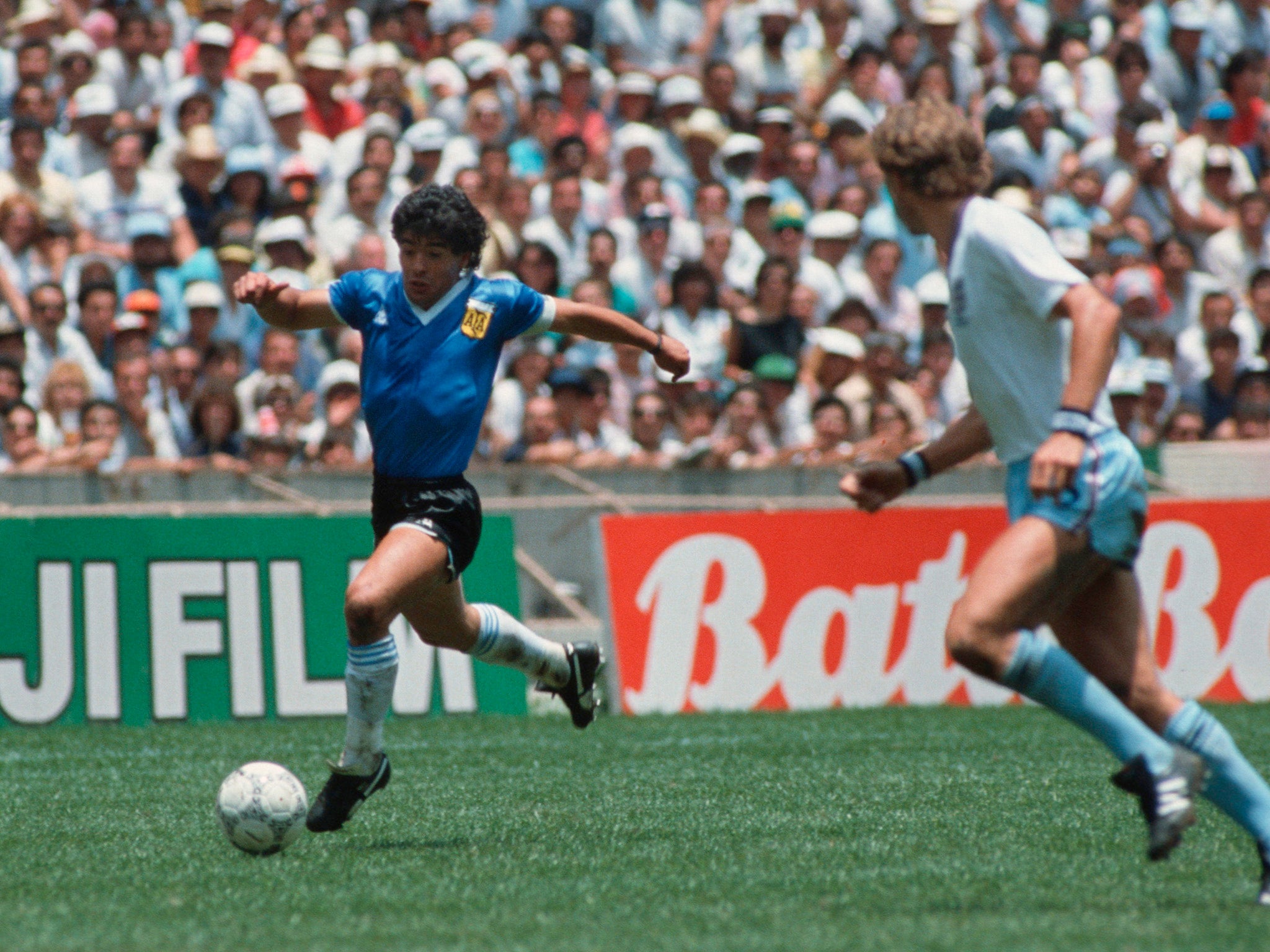 Maradona on his way to scoring one of the great World Cup goals