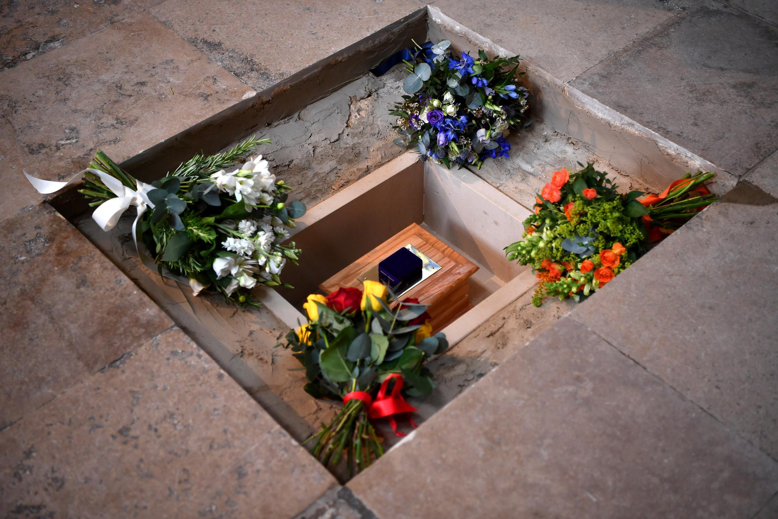 Flowers are placed alongside Hawking’s ashes