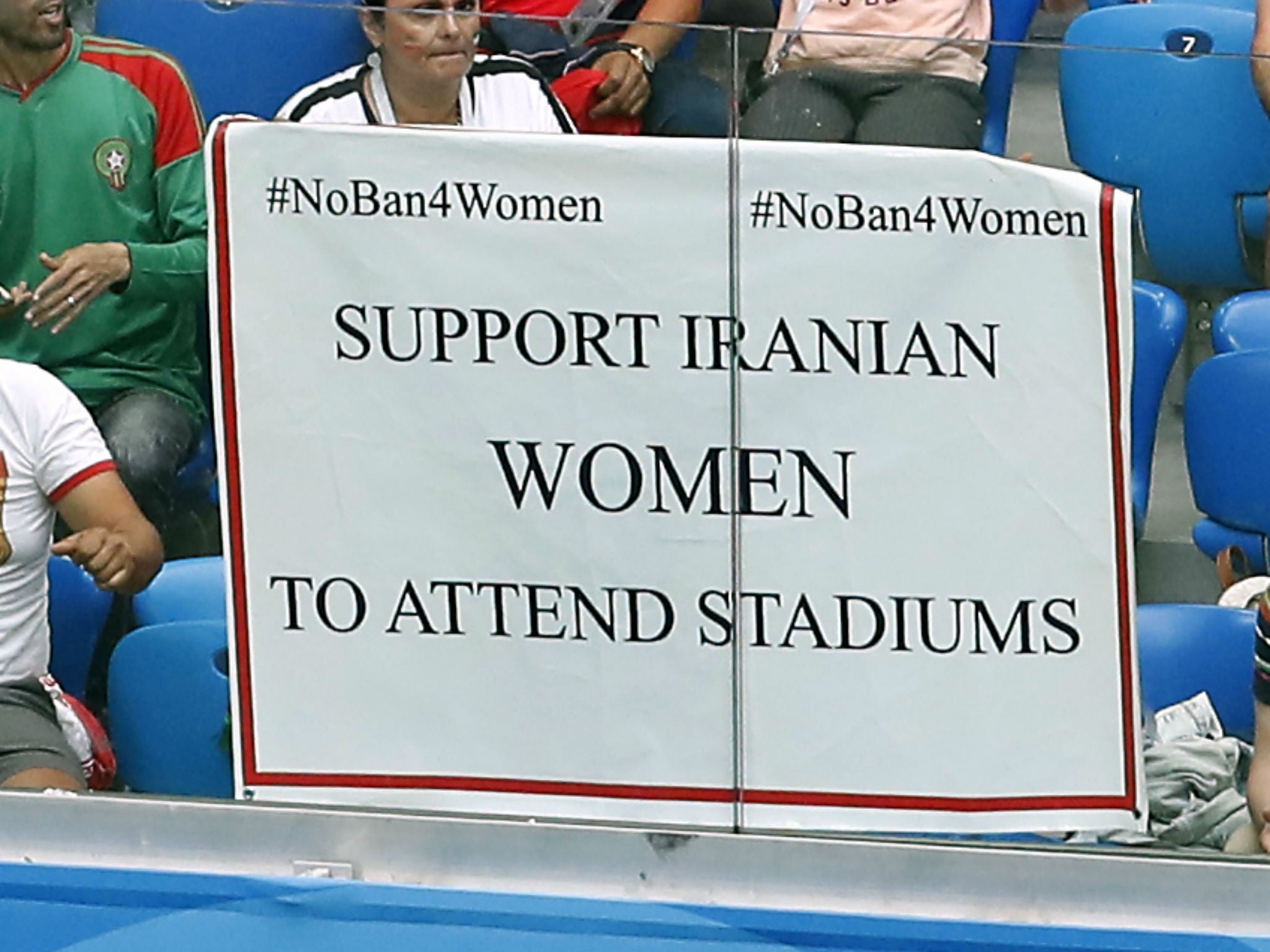 A poster supporting Iranian women is displayed in the stands