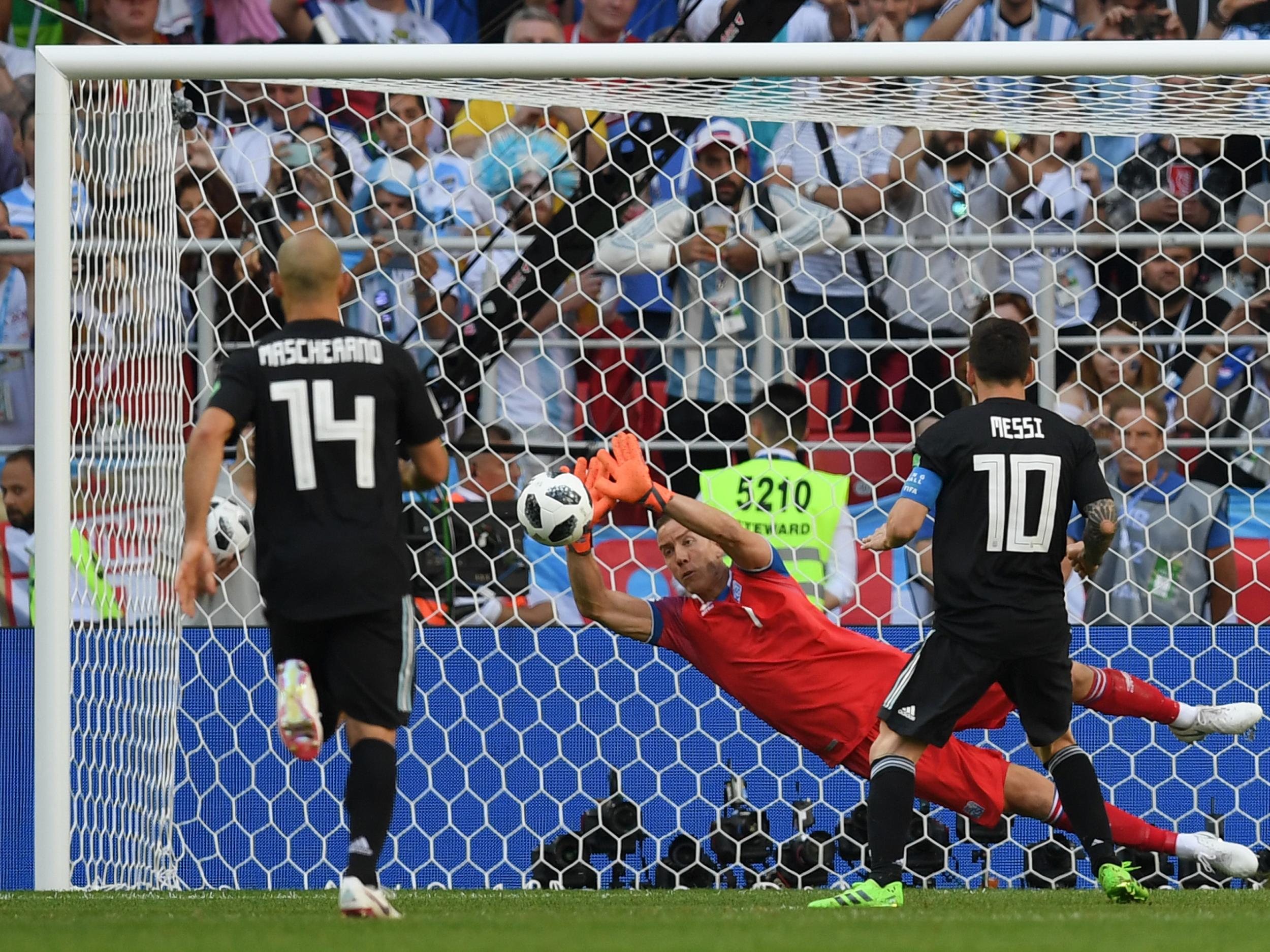 Hannes Halldorsson of Iceland saves a penalty from Lionel Messi of Argentina