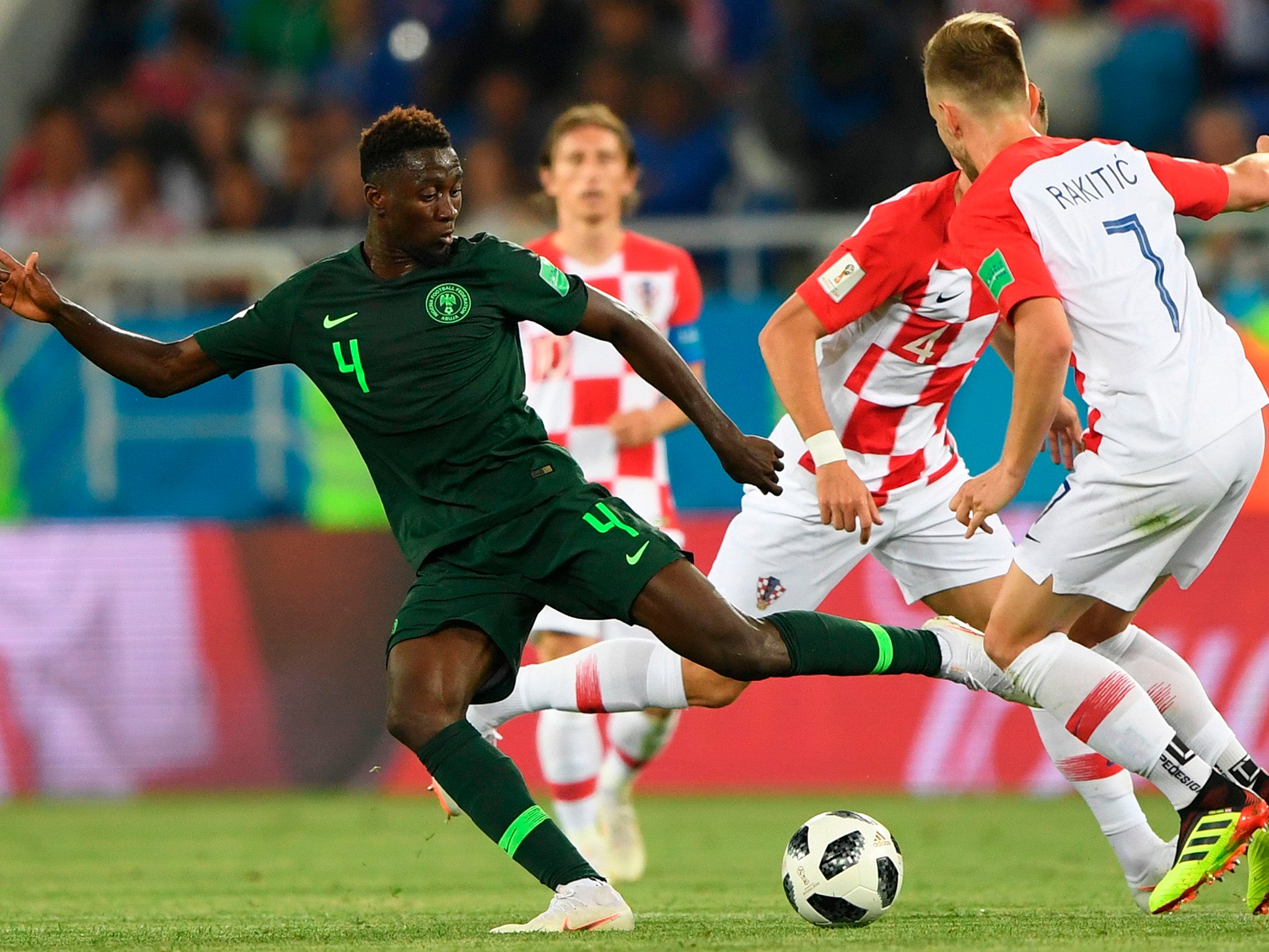 Wilfred Ndidi attempts to get a pass away under pressure from Ivan Rakitic