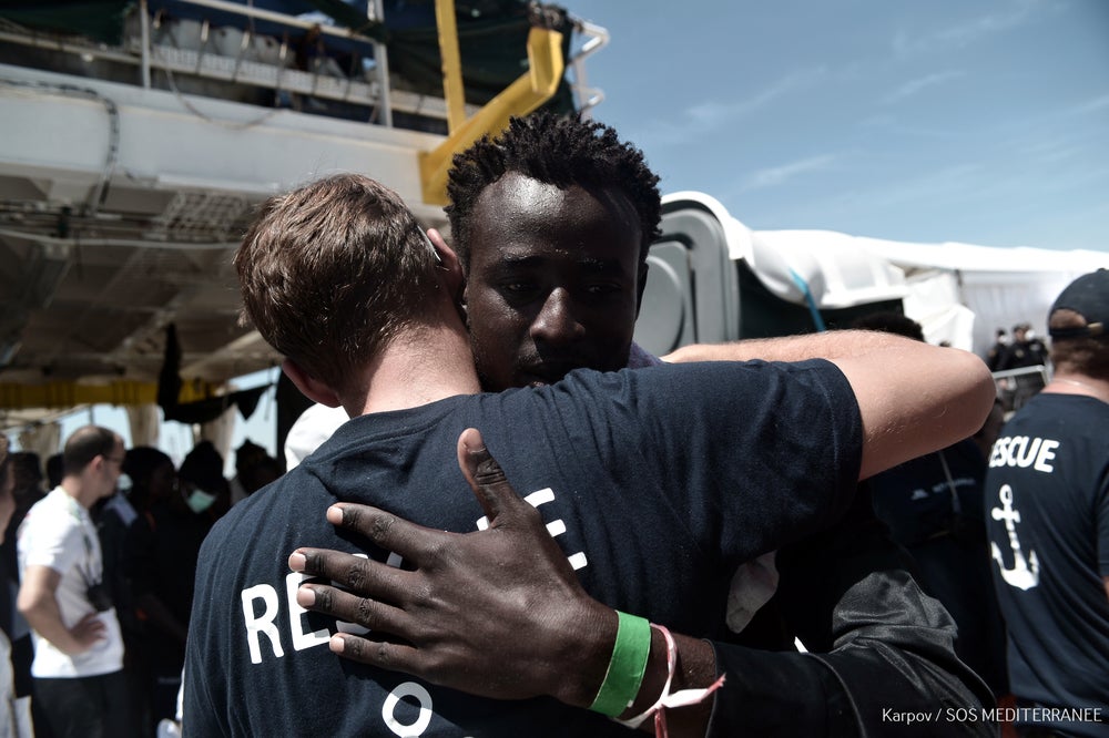 A migrant from the rescue vessel Aquarius arrives in Spain