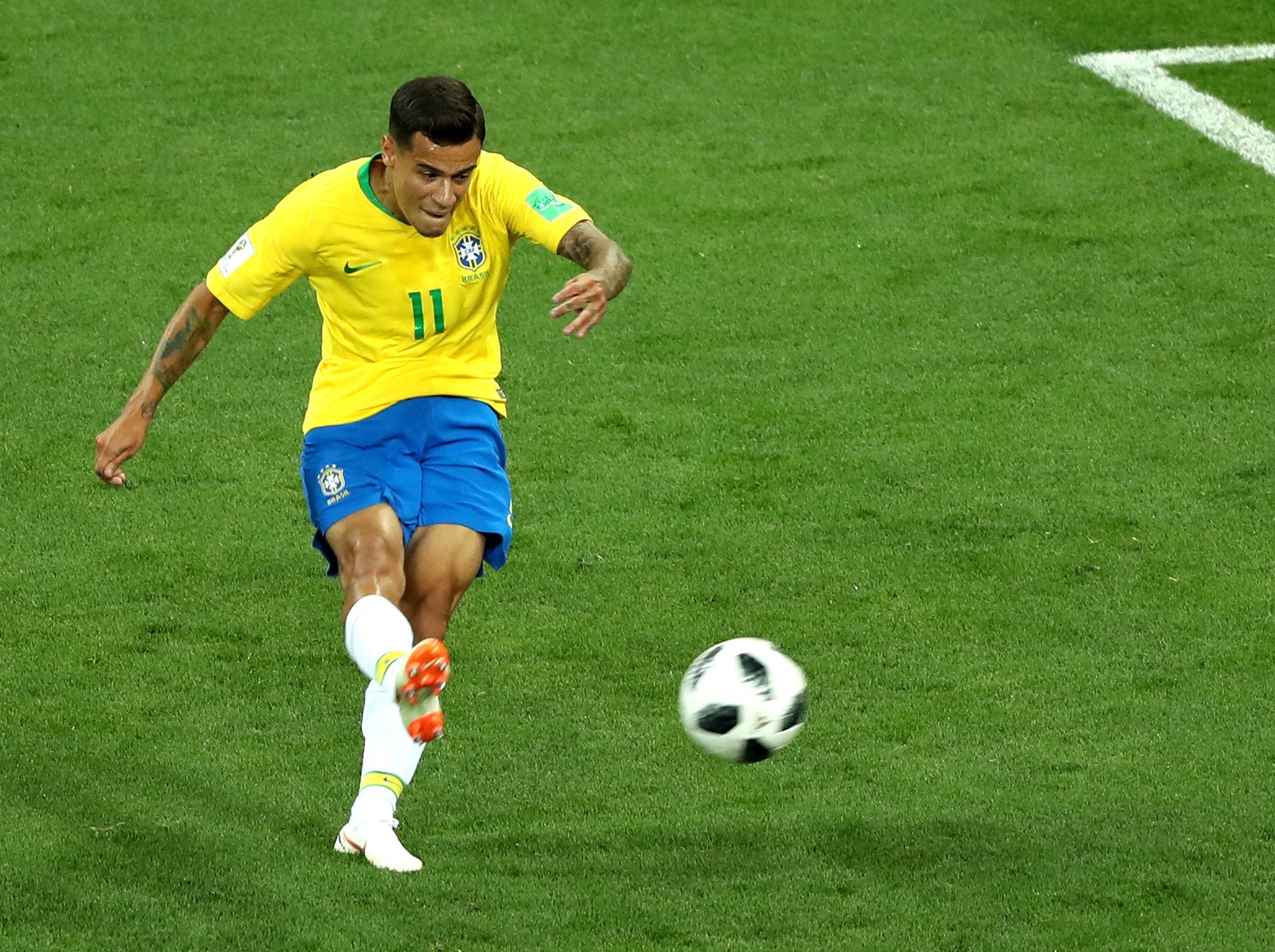 Philippe Coutinho bends in Brazil’s opener