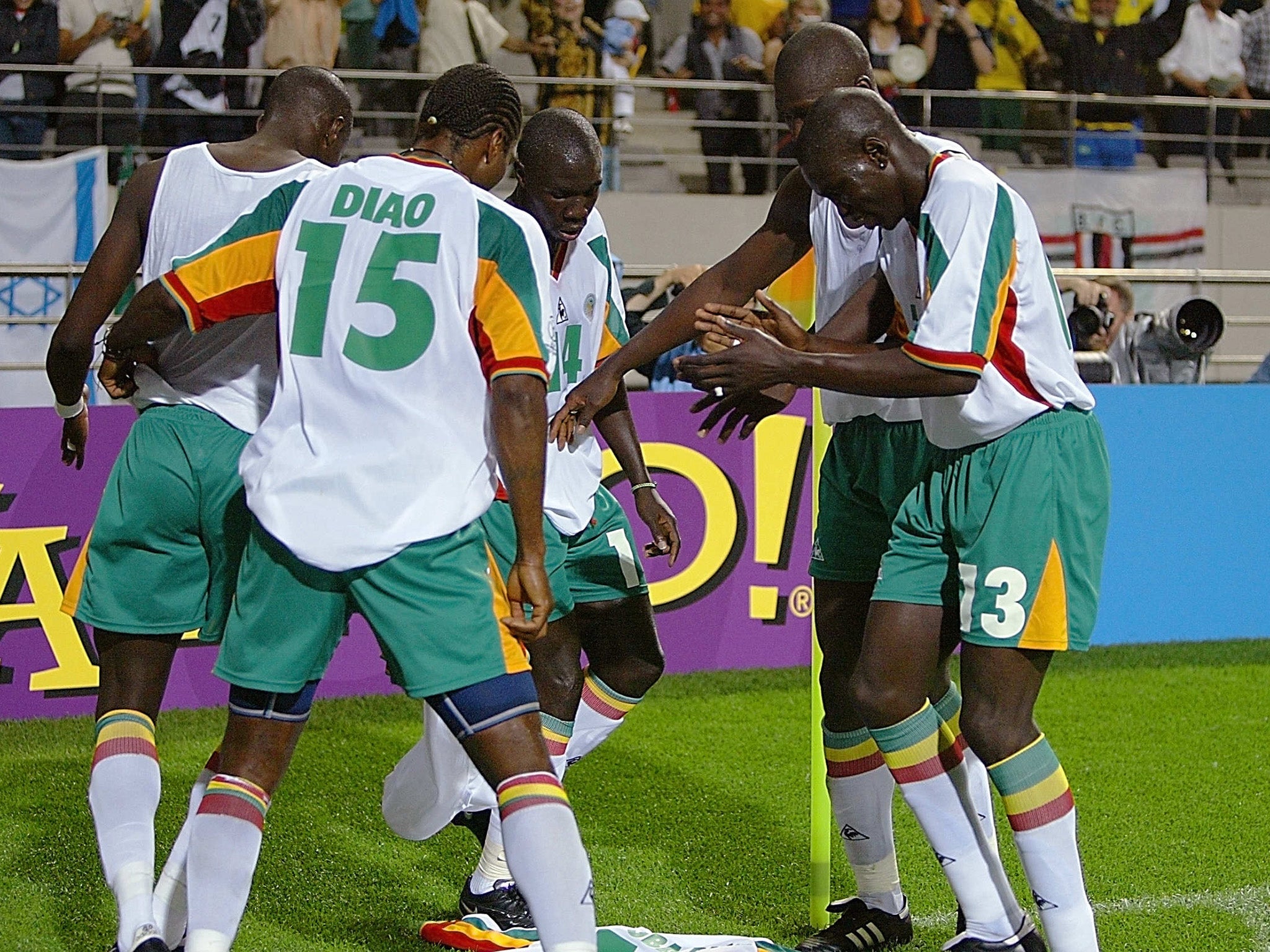 Senegal's players celebrate after scoring against France at the 2002 World Cup