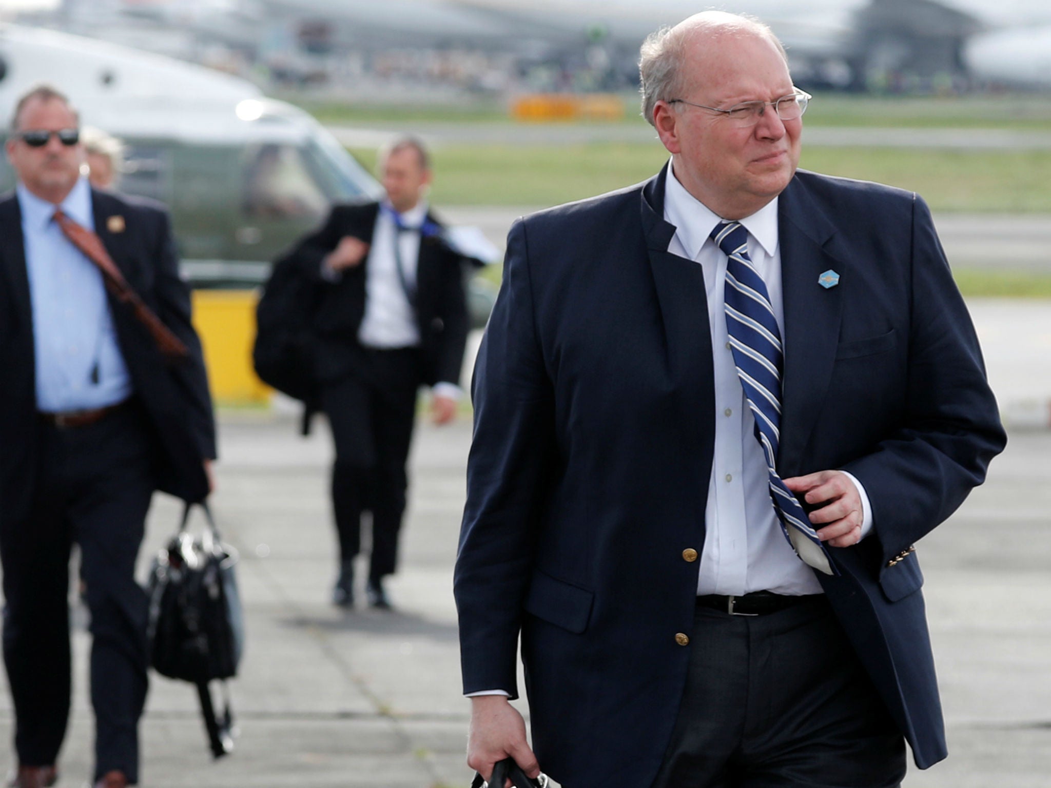 White House deputy chief of staff for operations Joe Hagin prepares to board Air Force One to return home with Donald Trump fro Manila, Philippines