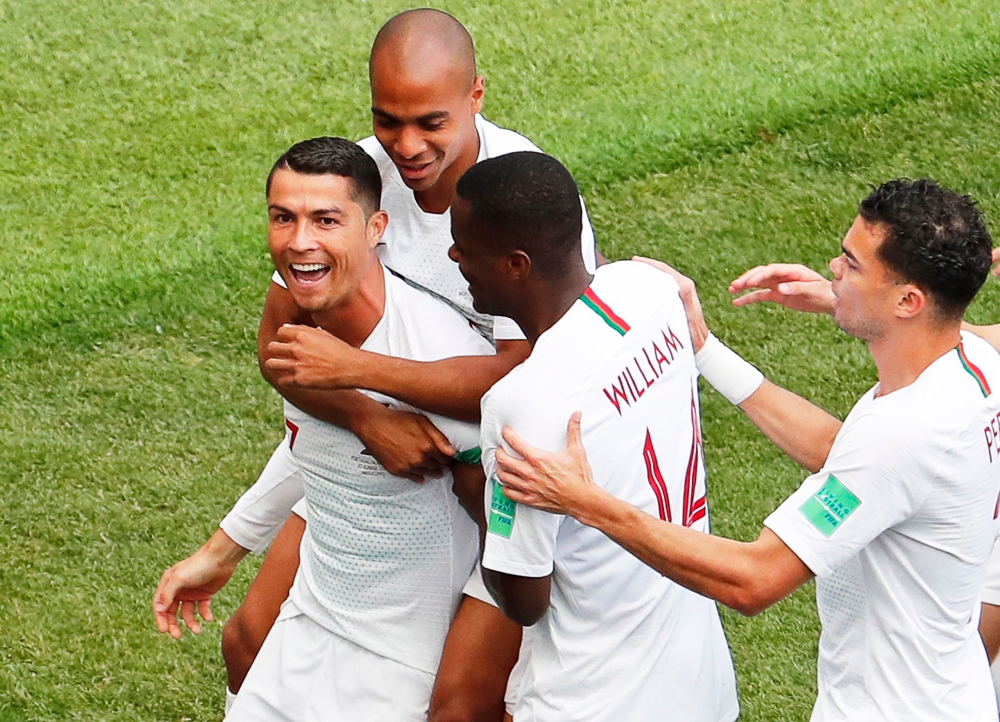 Cristiano Ronaldo (L) of Portugal celebrates with his teammates