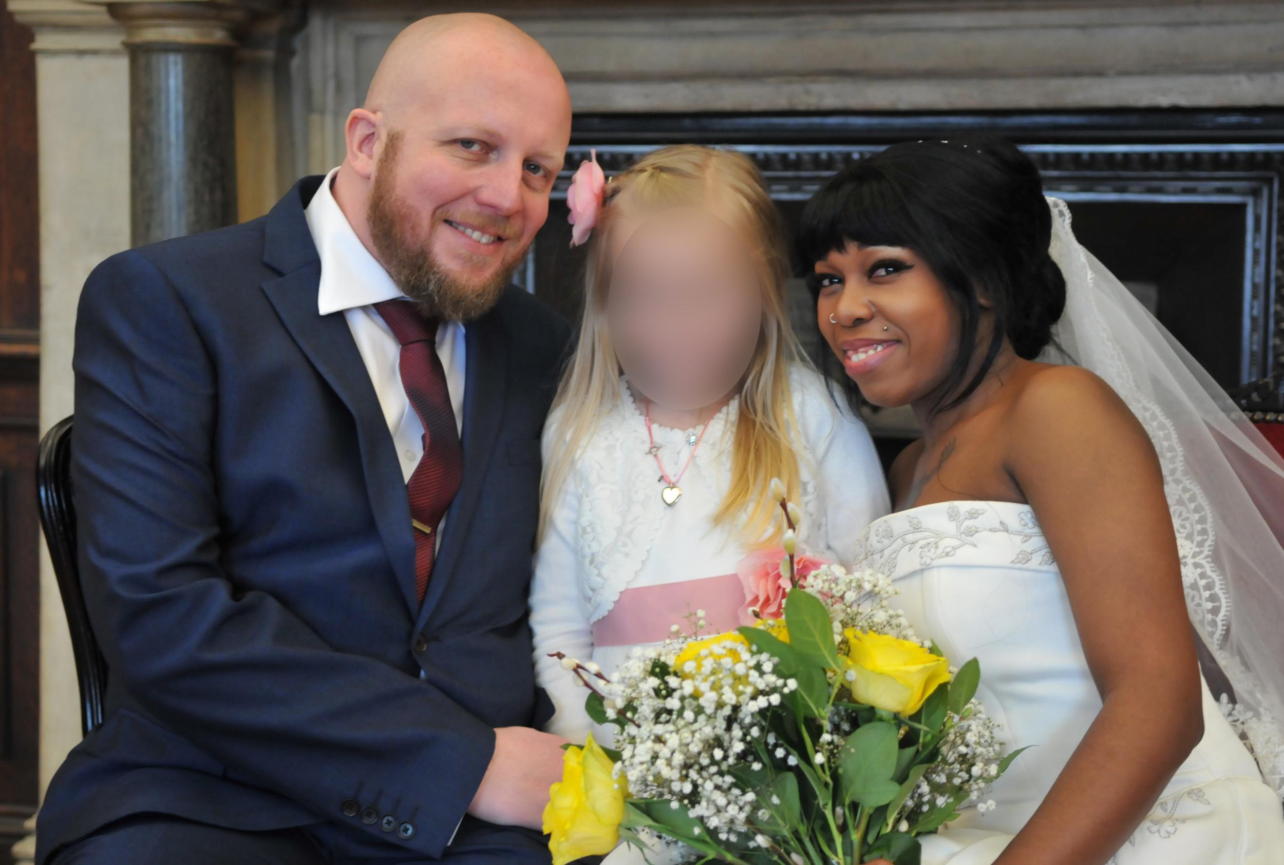 Michael Grieve and his wife Athena Grieve on their wedding day, with his eight-year-old daughter