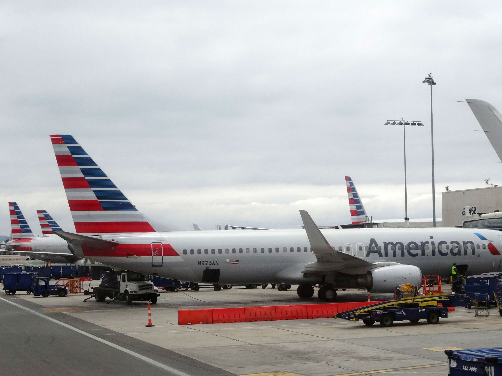 An American Airlines Boeing 737 800 sits at a gate at Los Angeles International Airport