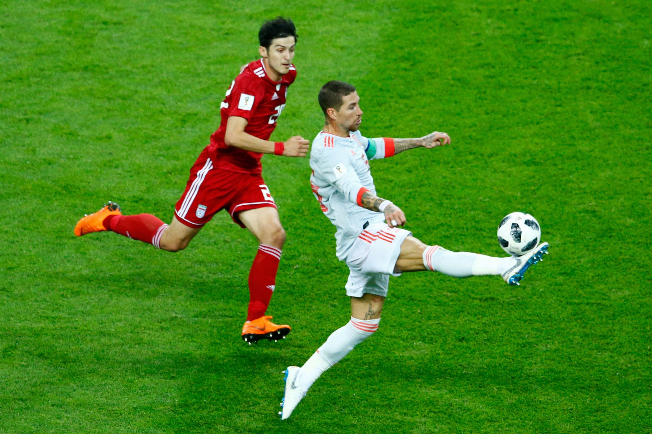 Sergio Ramos defends against striker Sardar Azmoun