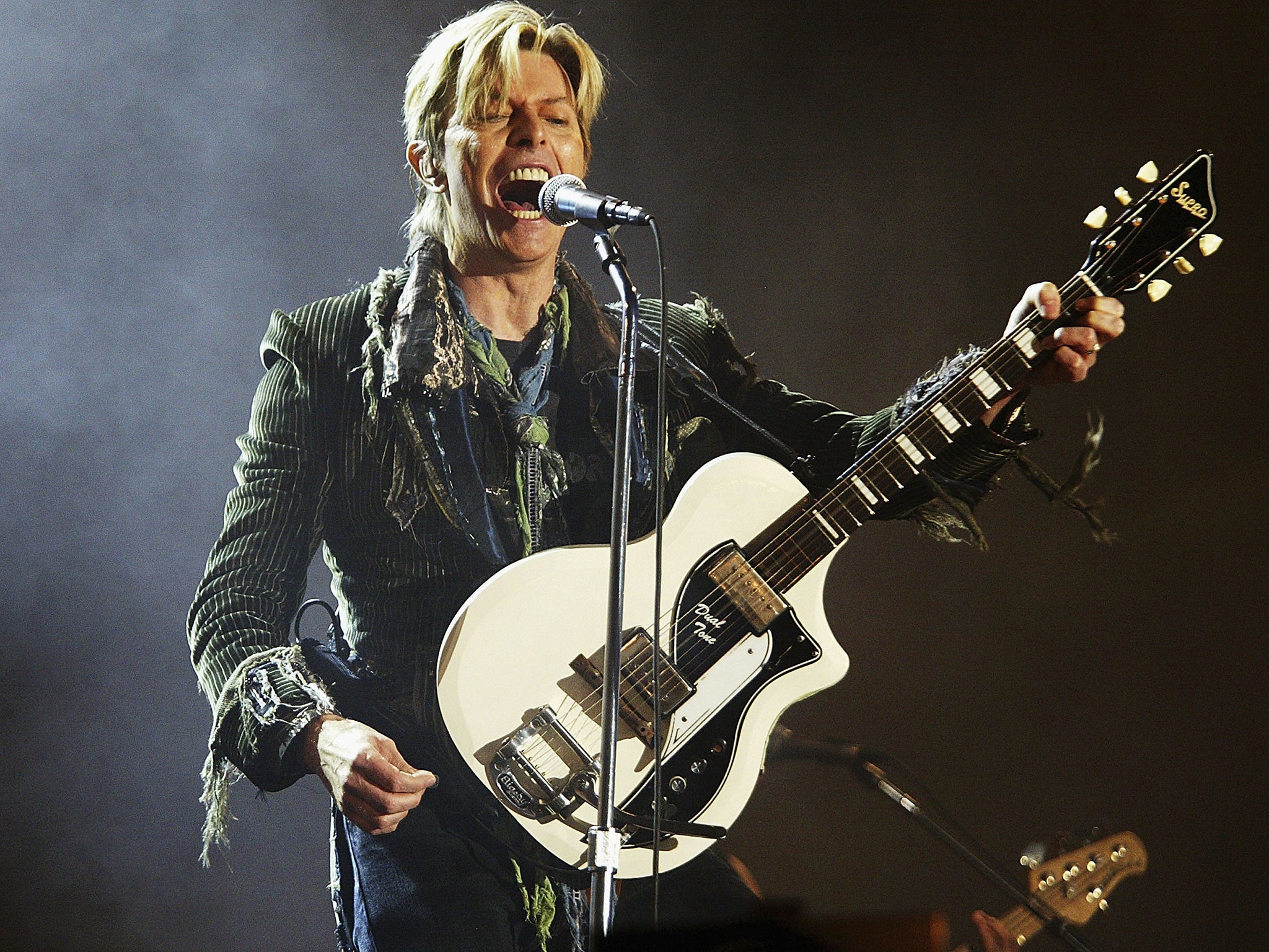 David Bowie performs at Isle of Wight Festival in 2004