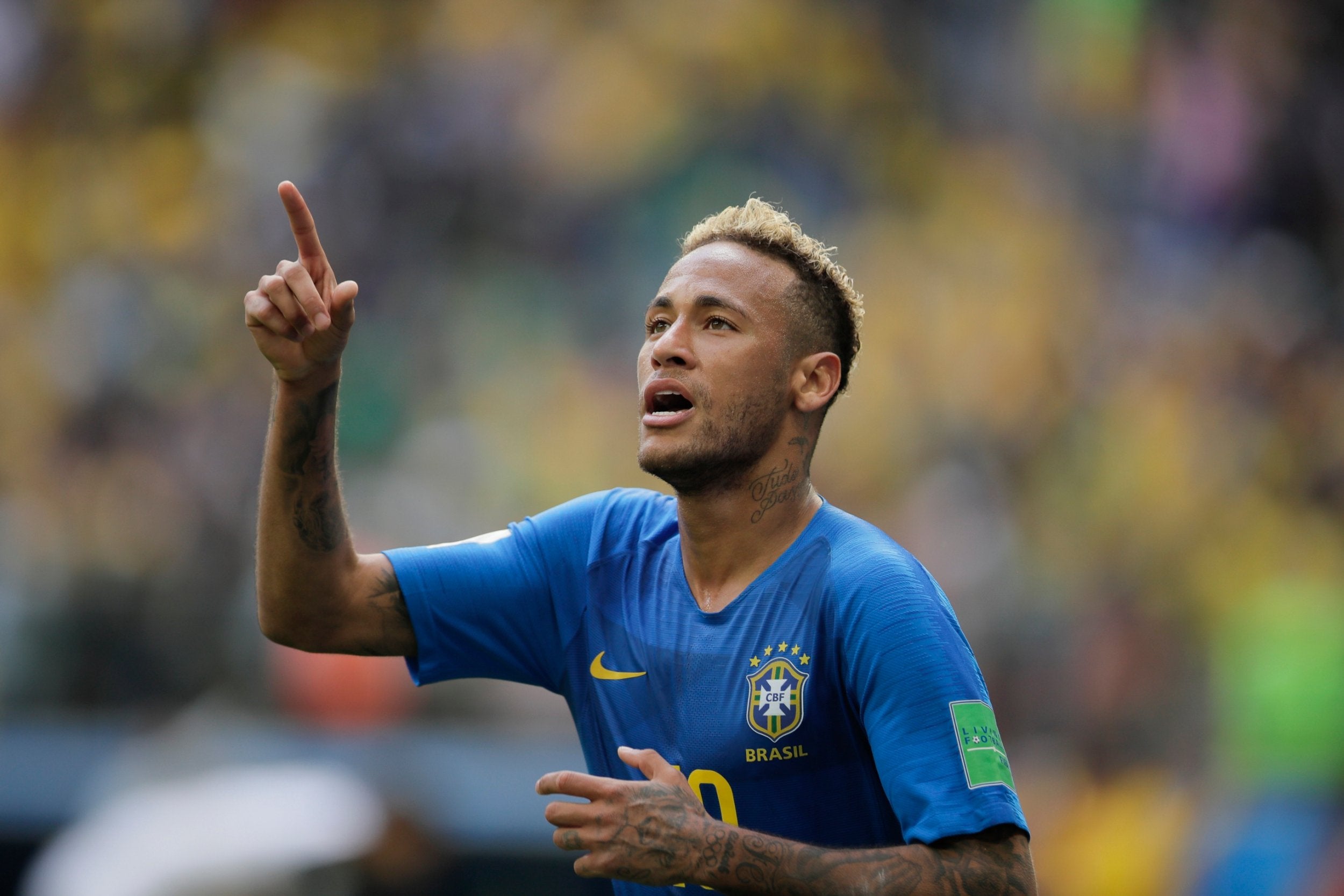 Neymar celebrates after scoring his side’s second goal