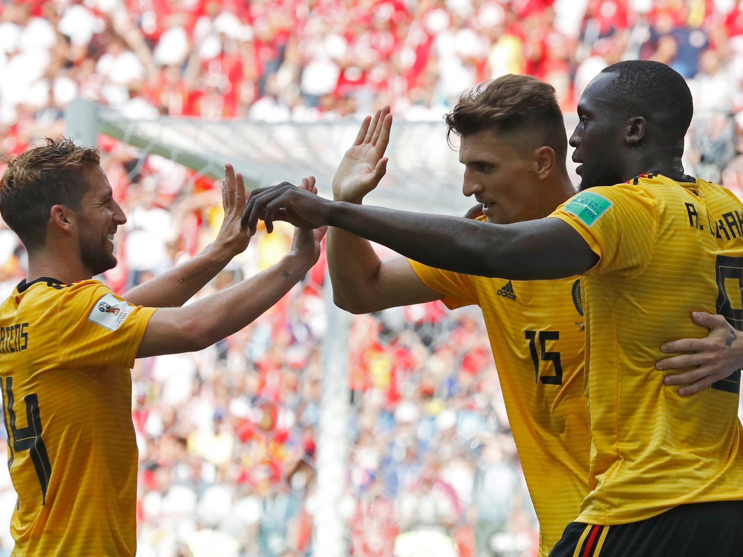 Romelu Lukaku (right) celebrates with teammates Dries Mertens, left, and Thomas Meunier after scoring their team's third goal