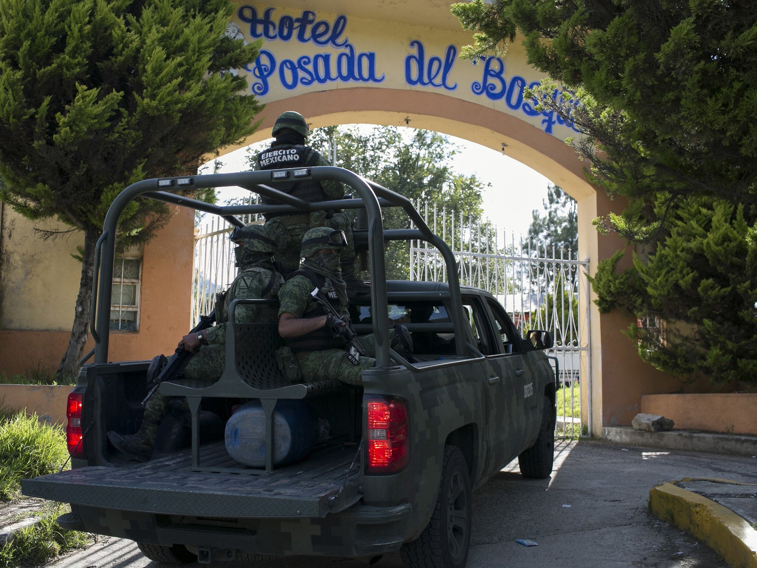 Mexican soldiers guard the funeral of Fernando Angeles Juarez, who was running for municipality mayor, in Ocampo, Michoacan State