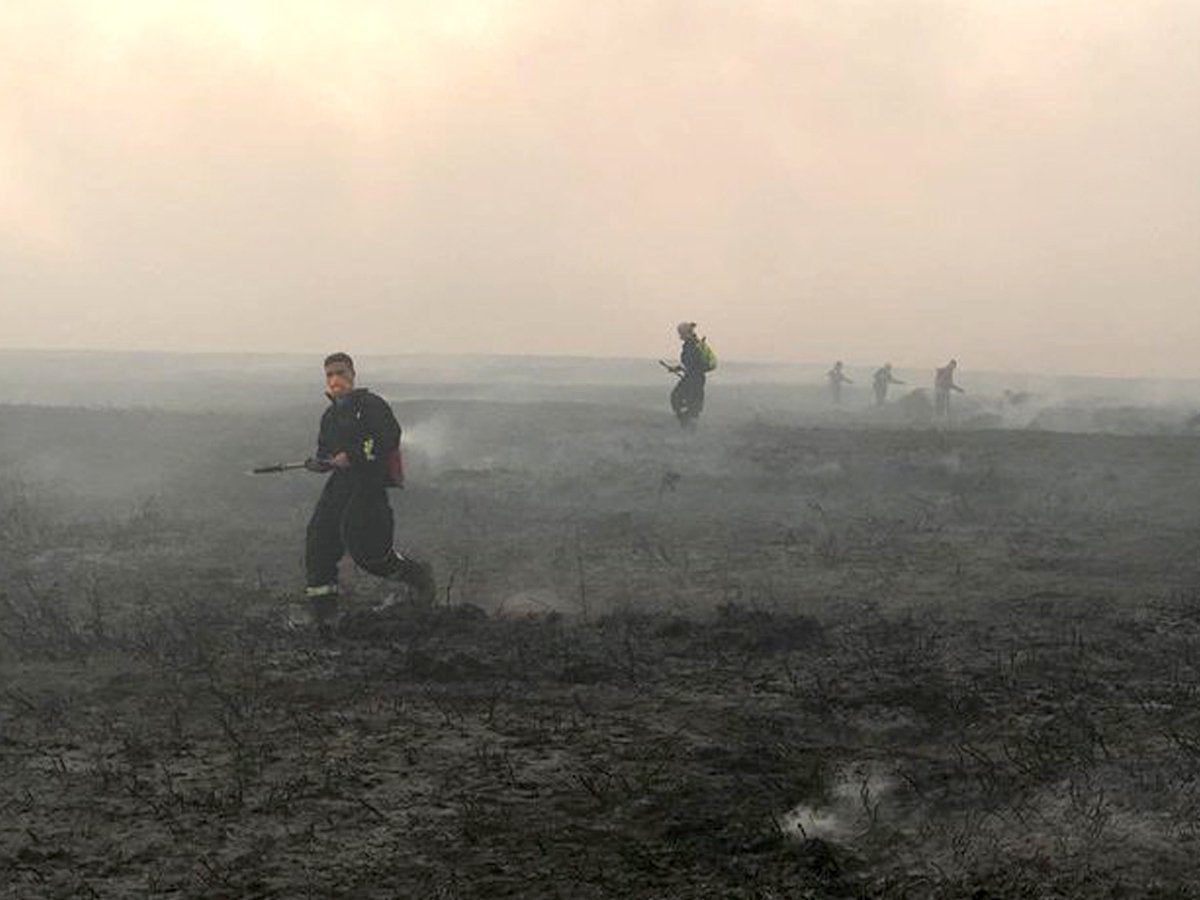 Firefighters battling a blaze at Tintwistle in 2018.