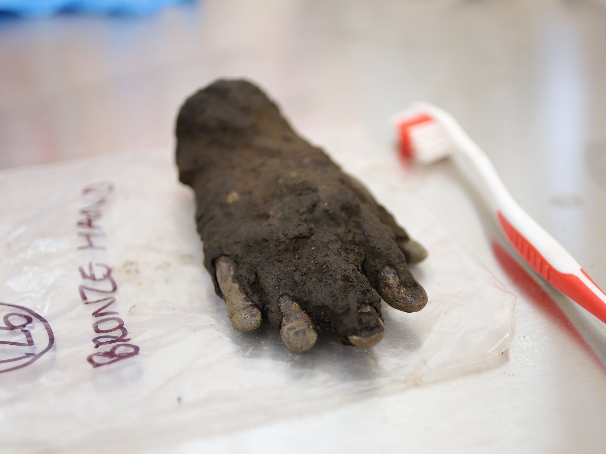 Bronze hand of the Roman god, Jupiter Dolichenus, before conservation