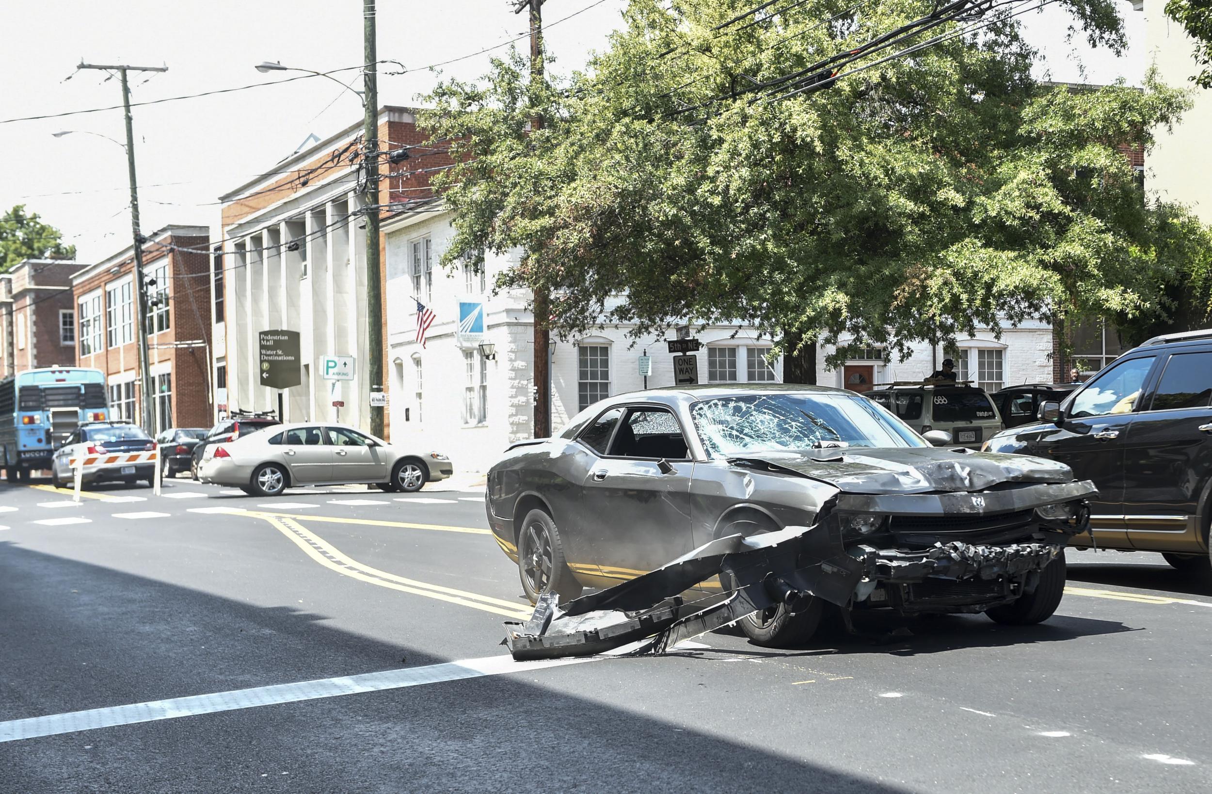 The silver Dodge Charger allegedly driven by James Alex Fields Jr passes near the Market Street Parking Garage moments after driving into a crowd of counter-protesters