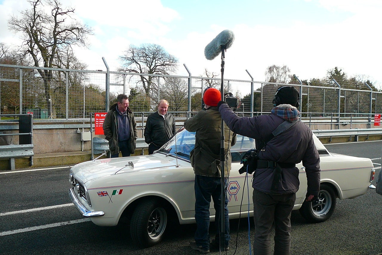 Grease lightning! Lee, second from left, inspects the 1600E he used to own