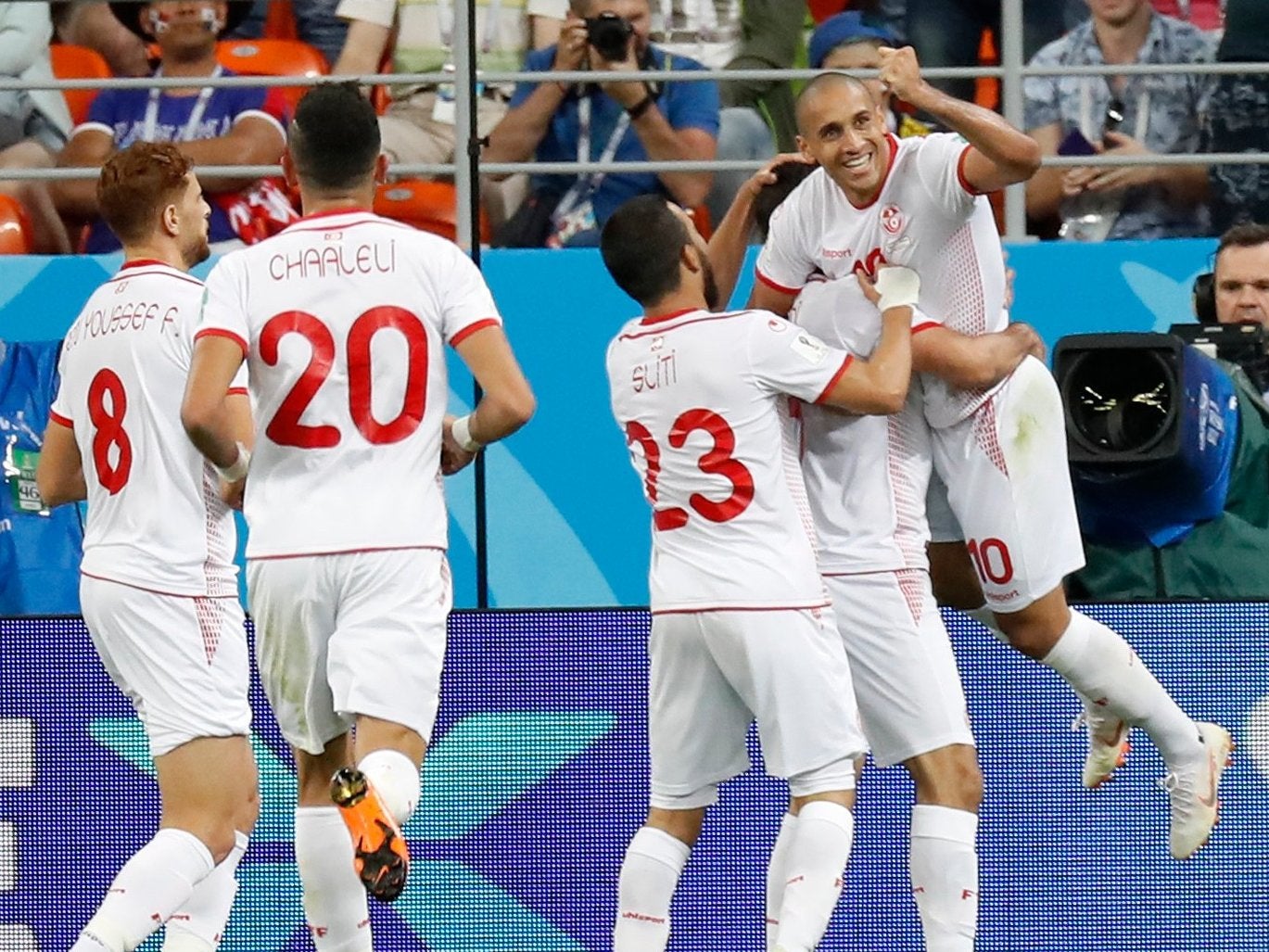 Tunisia's Wahbi Khazri, right, celebrates with teammates after scoring his side's second goal