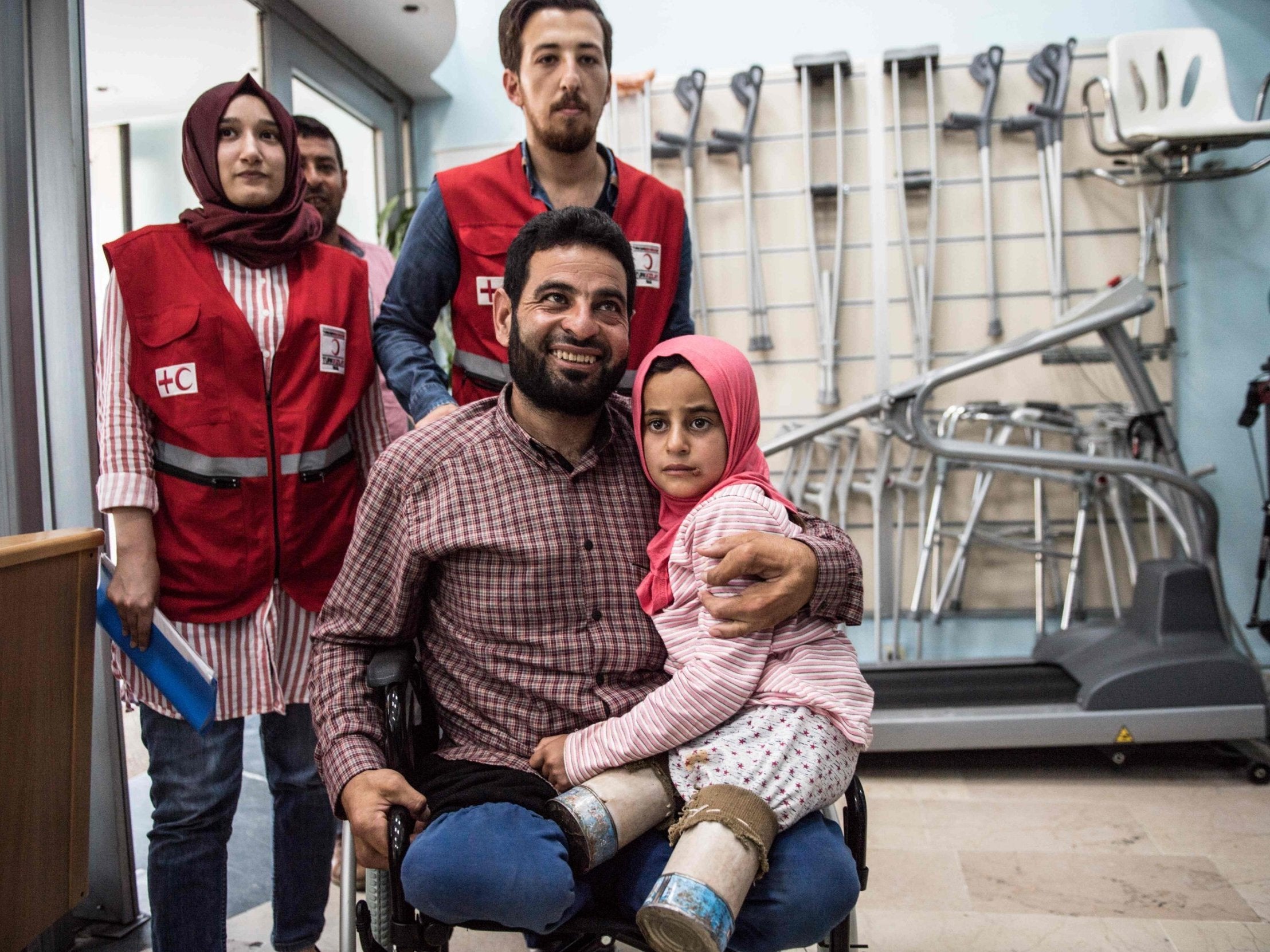 Maya and her father, both born without legs, at the Istanbul clinic where they will be given new limbs