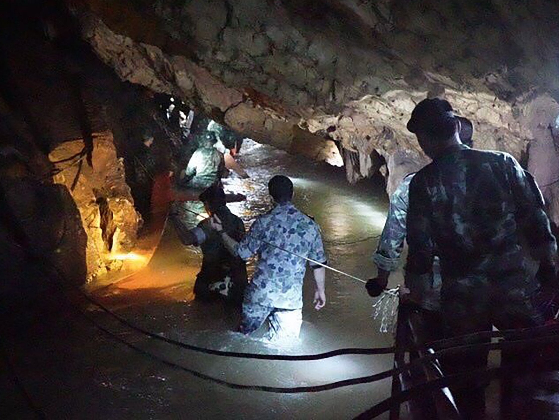 Thai Navy SEAL divers inspect the flooded tunnel in the Tham Luang cave.