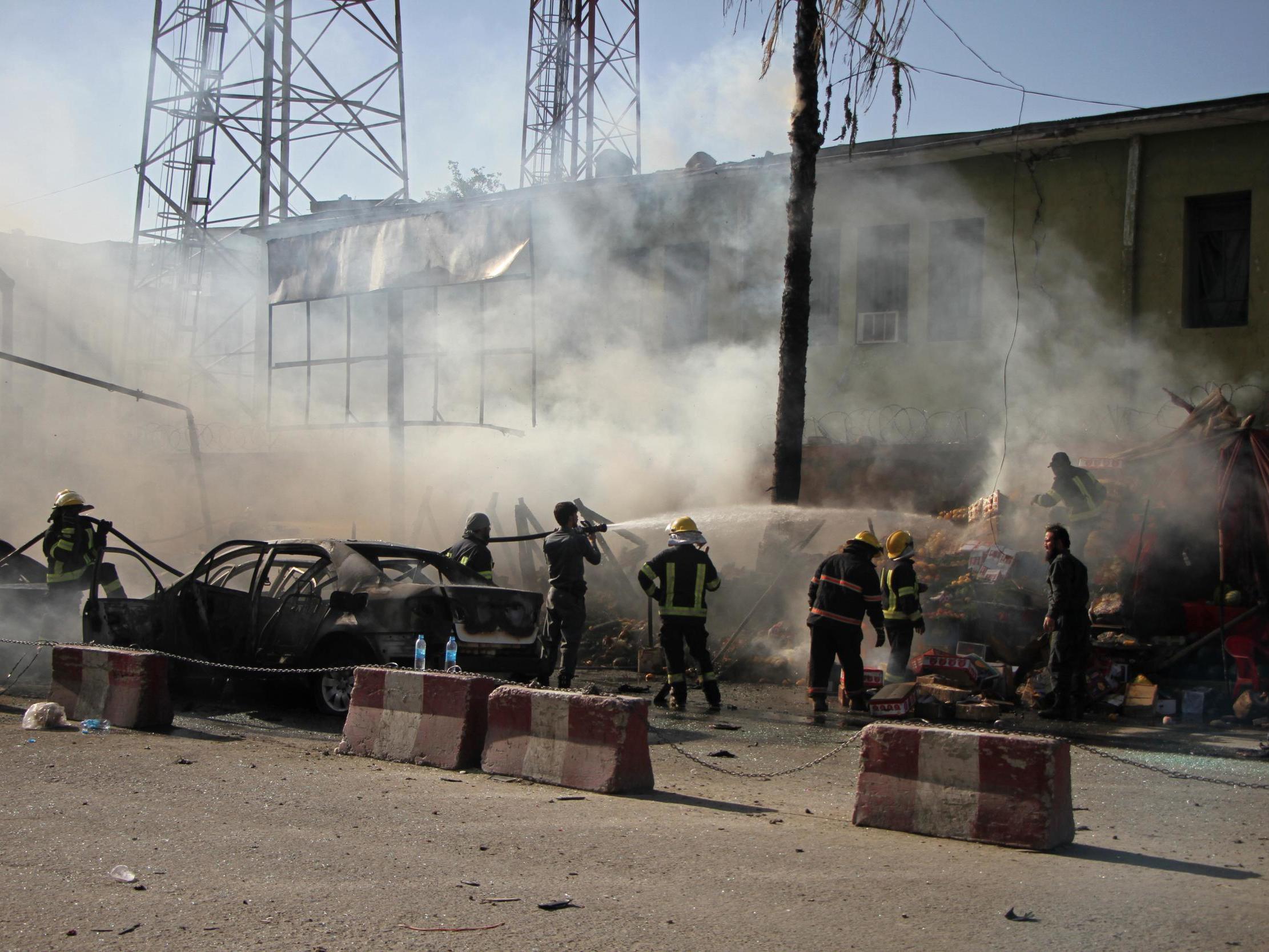 Security forces at the scene of the attack, which killed killed at least 19 people and left a similar number injured