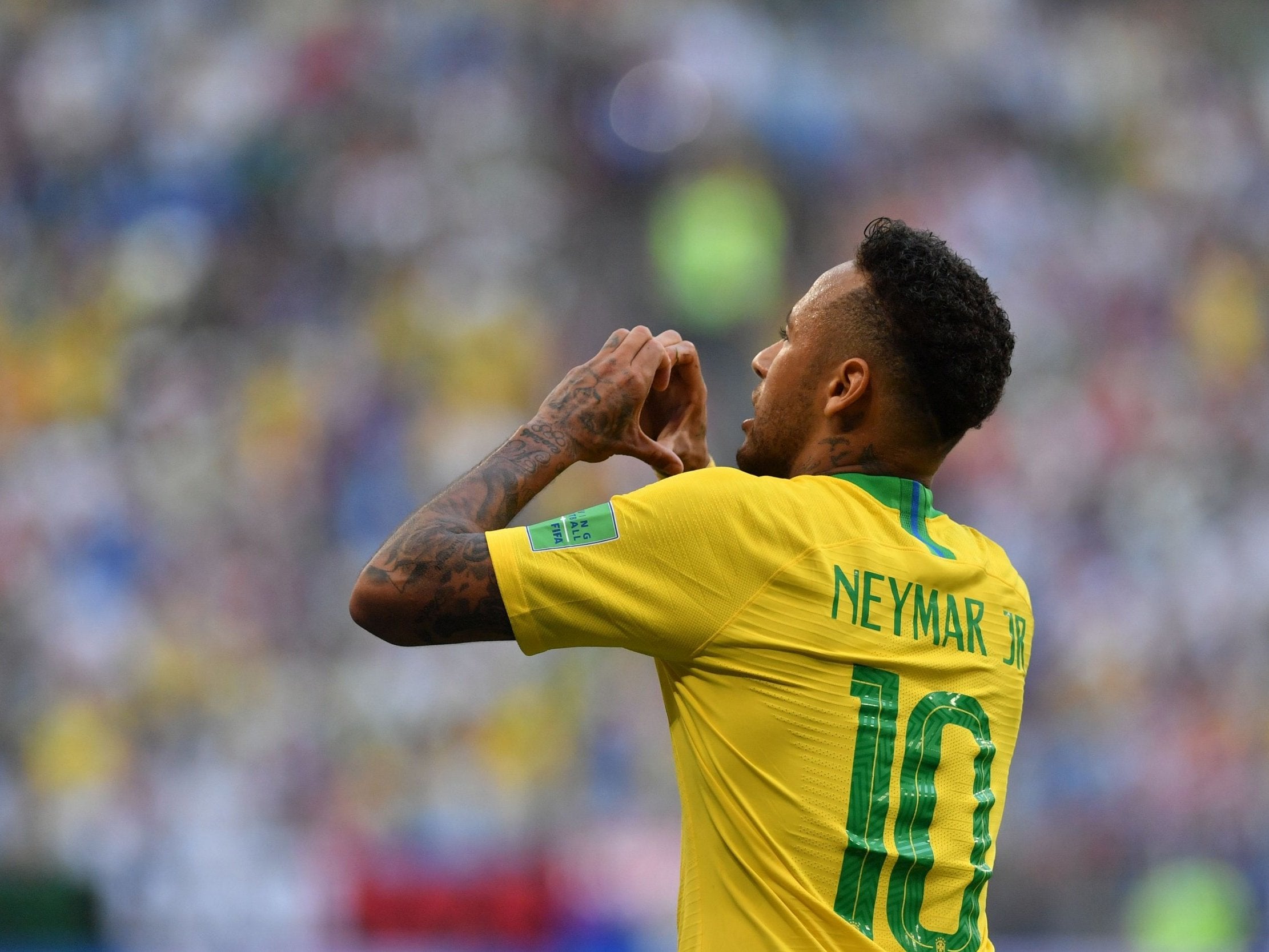 Brazil's forward Neymar celebrates after scoring the opening goal