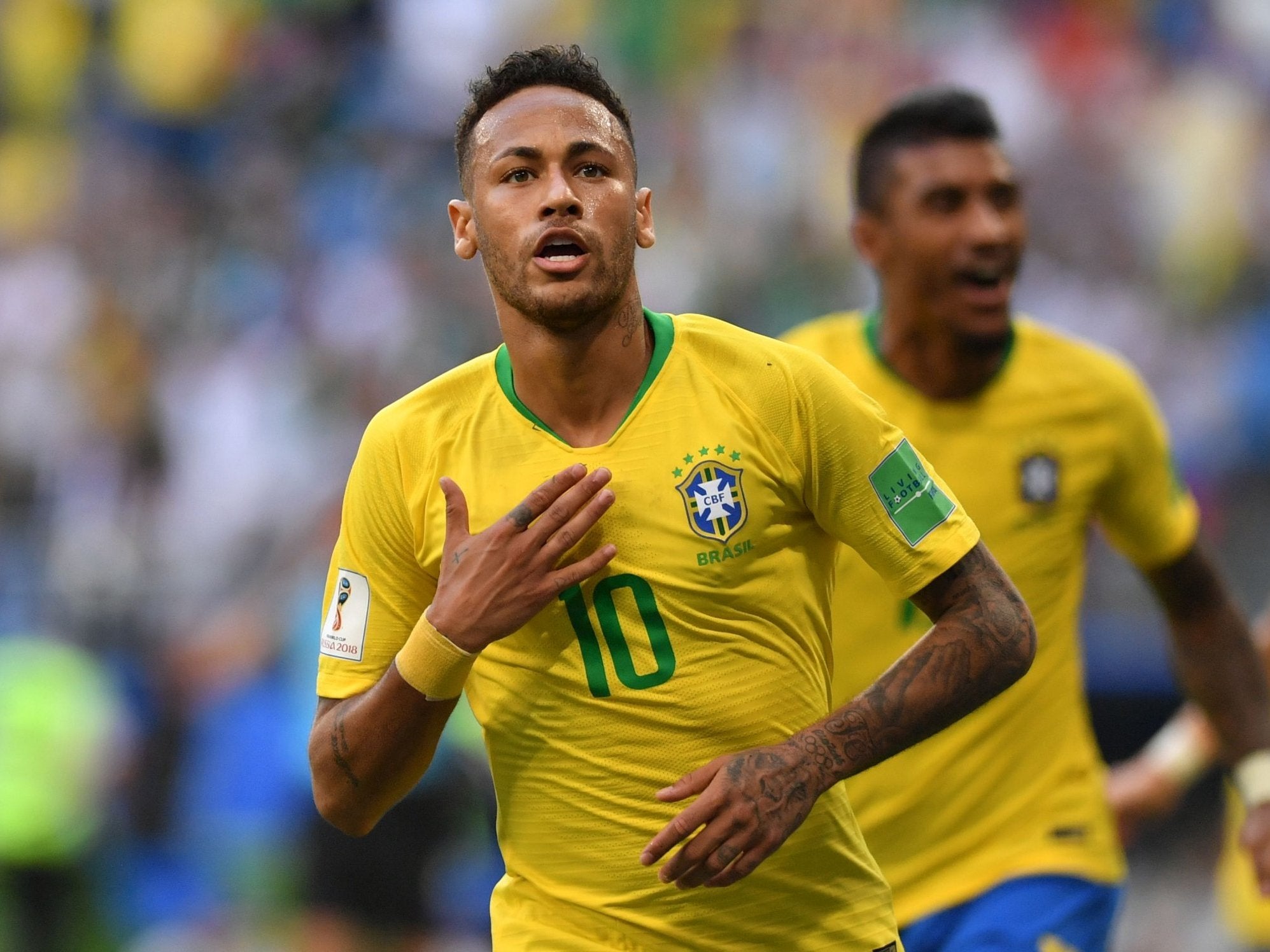 Brazil's forward Neymar celebrates after scoring the opening goal