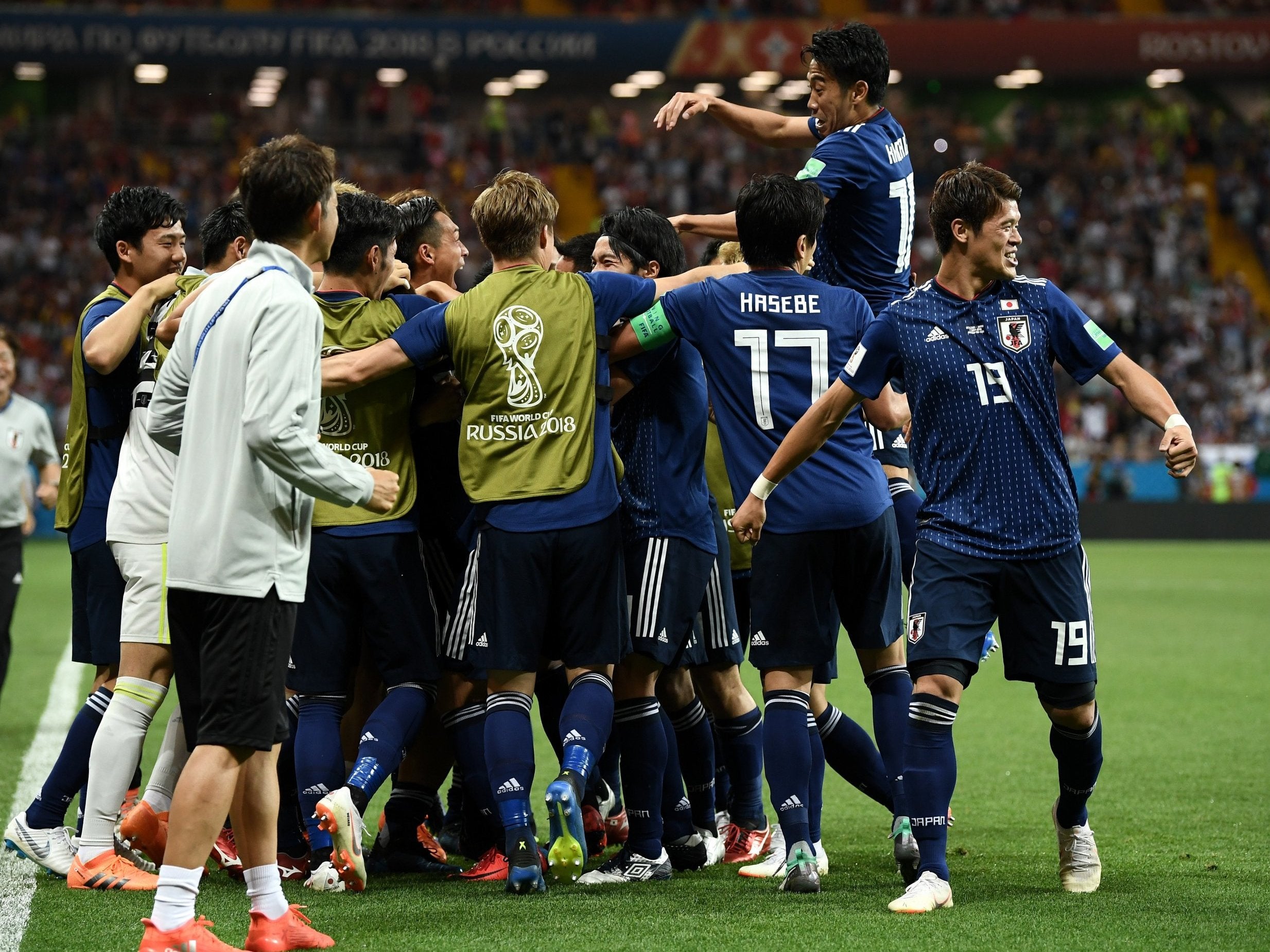 Takashi Inui of Japan celebrates with teammates after scoring his team's second goal