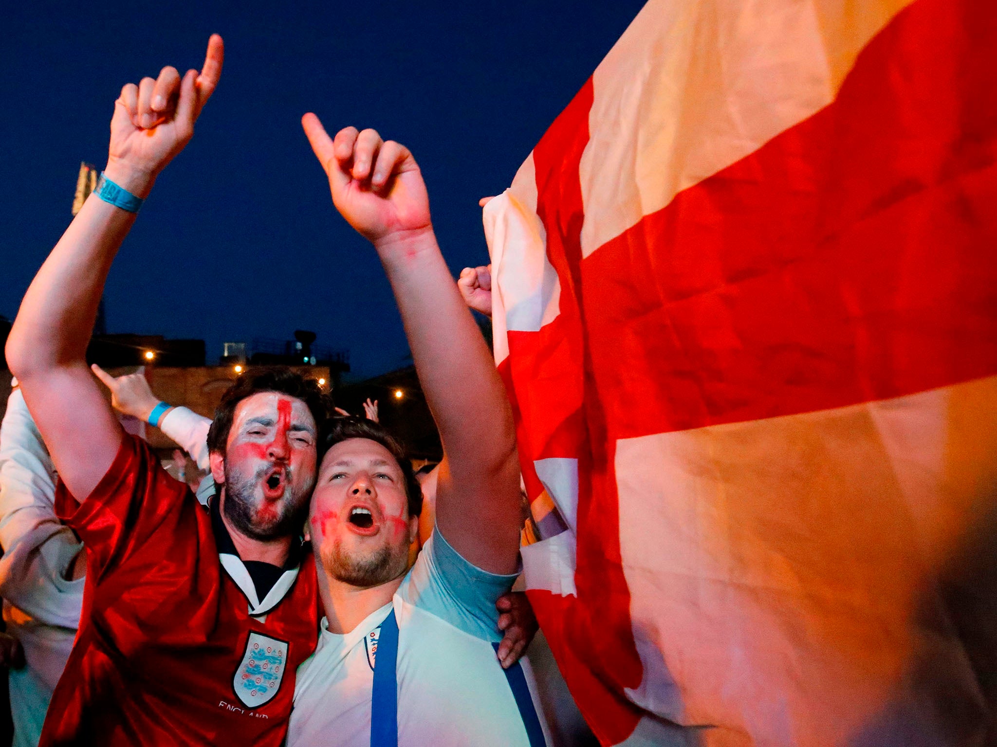 England fans celebrate after England won in the penalty shootout