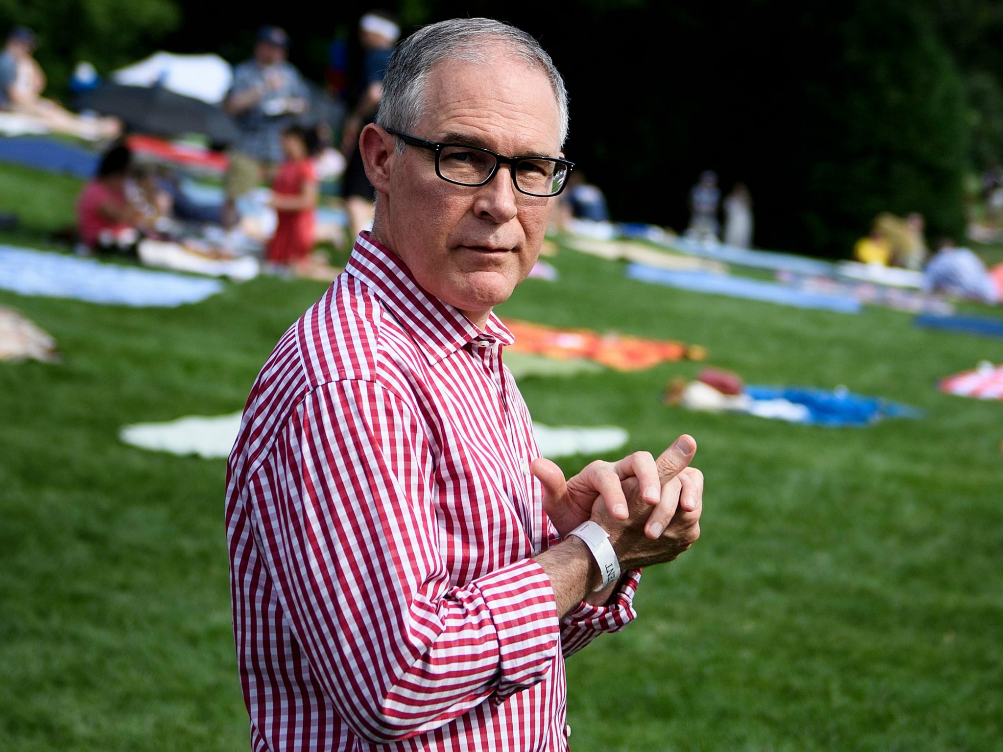 Recently-resigned Environmental Protection Agency Administrator Scott Pruitt walks during a picnic for military families at the White House 4 July 2018.