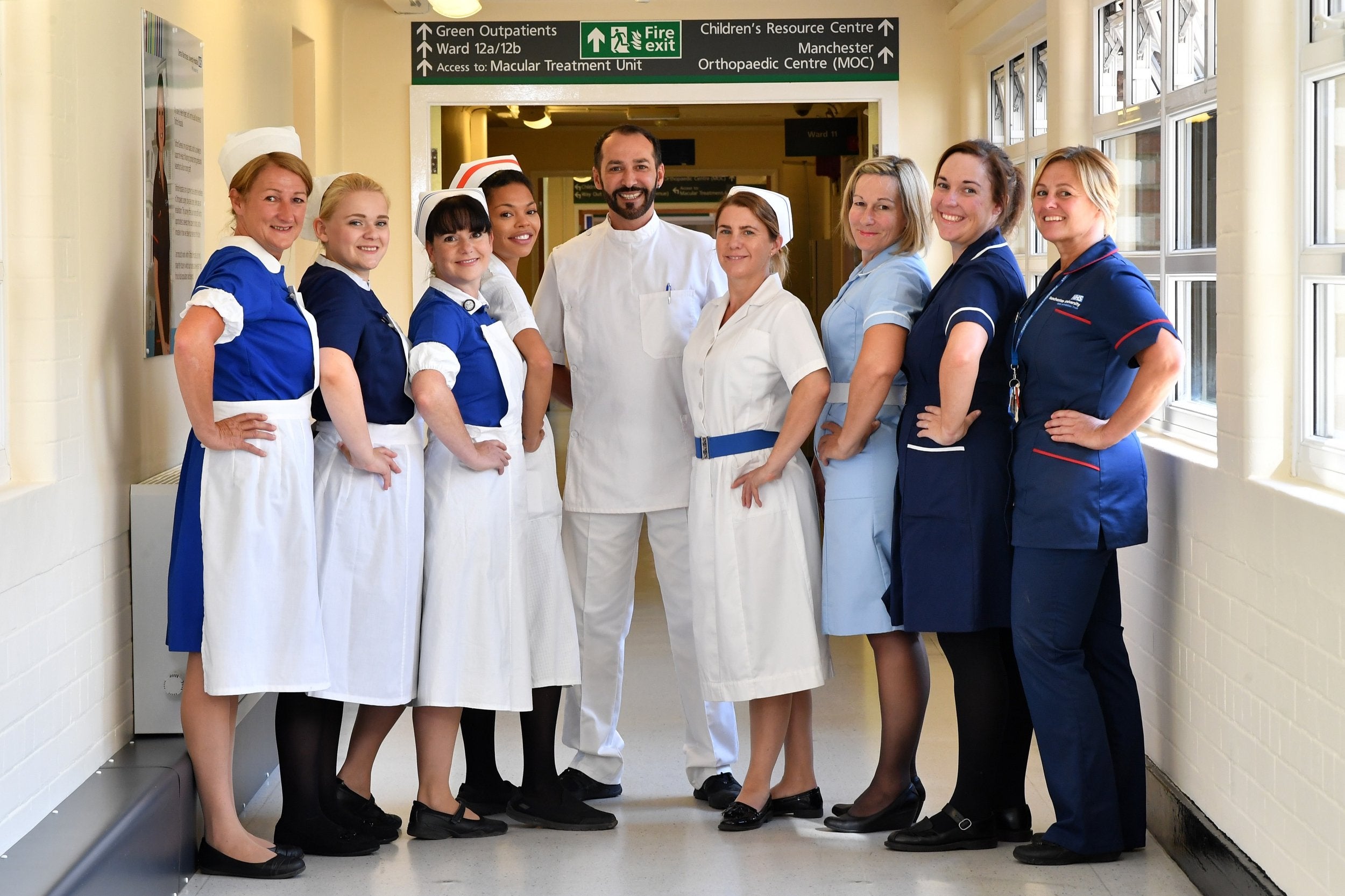 Nurses in uniforms to represent each decade of the NHS