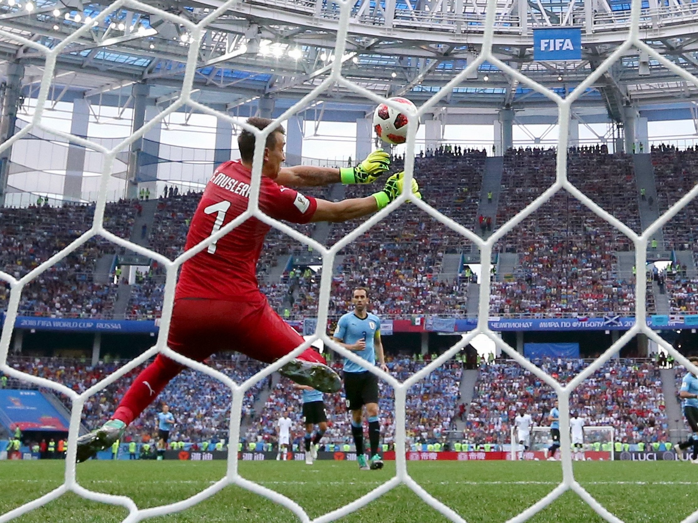 Fernando Muslera fumbles the ball following Antoine Griezmann's shot