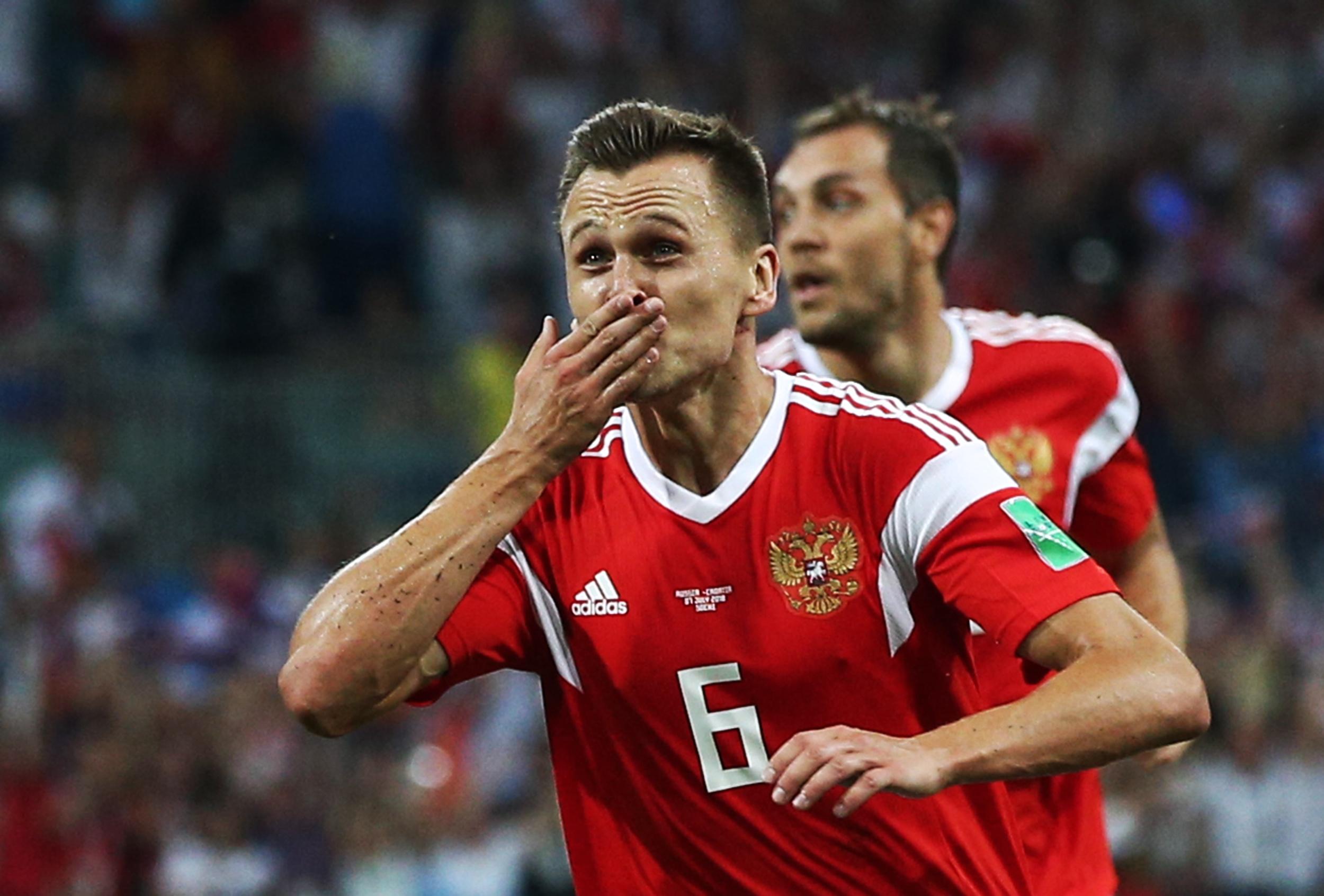 Denis Cheryshev celebrates Russia's opener