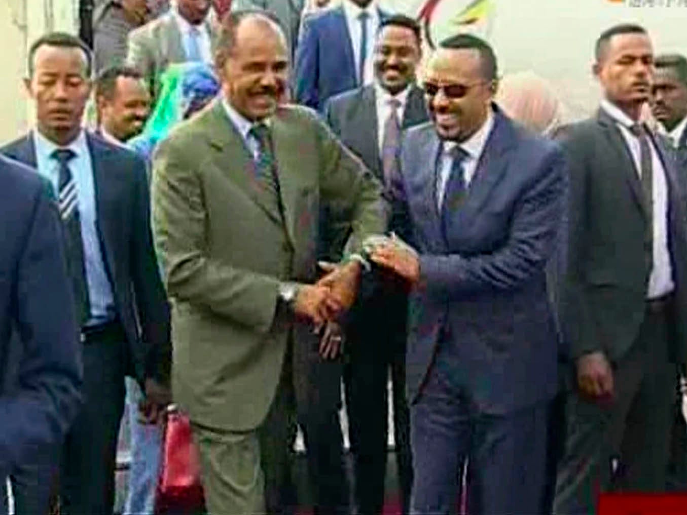 The moment was captured on live broadcast as Ethiopia's Prime Minister Abiy Ahmed, (centre right) was greeted at the airport by Eritrea's President Isaias Afwerki