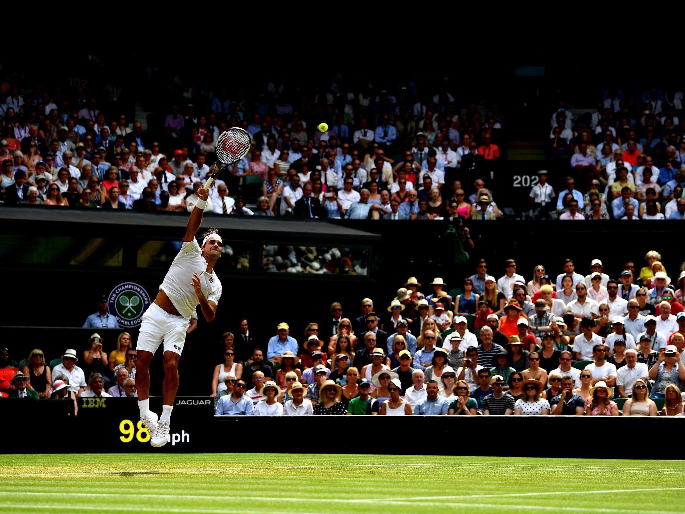 Federer serves during the second set