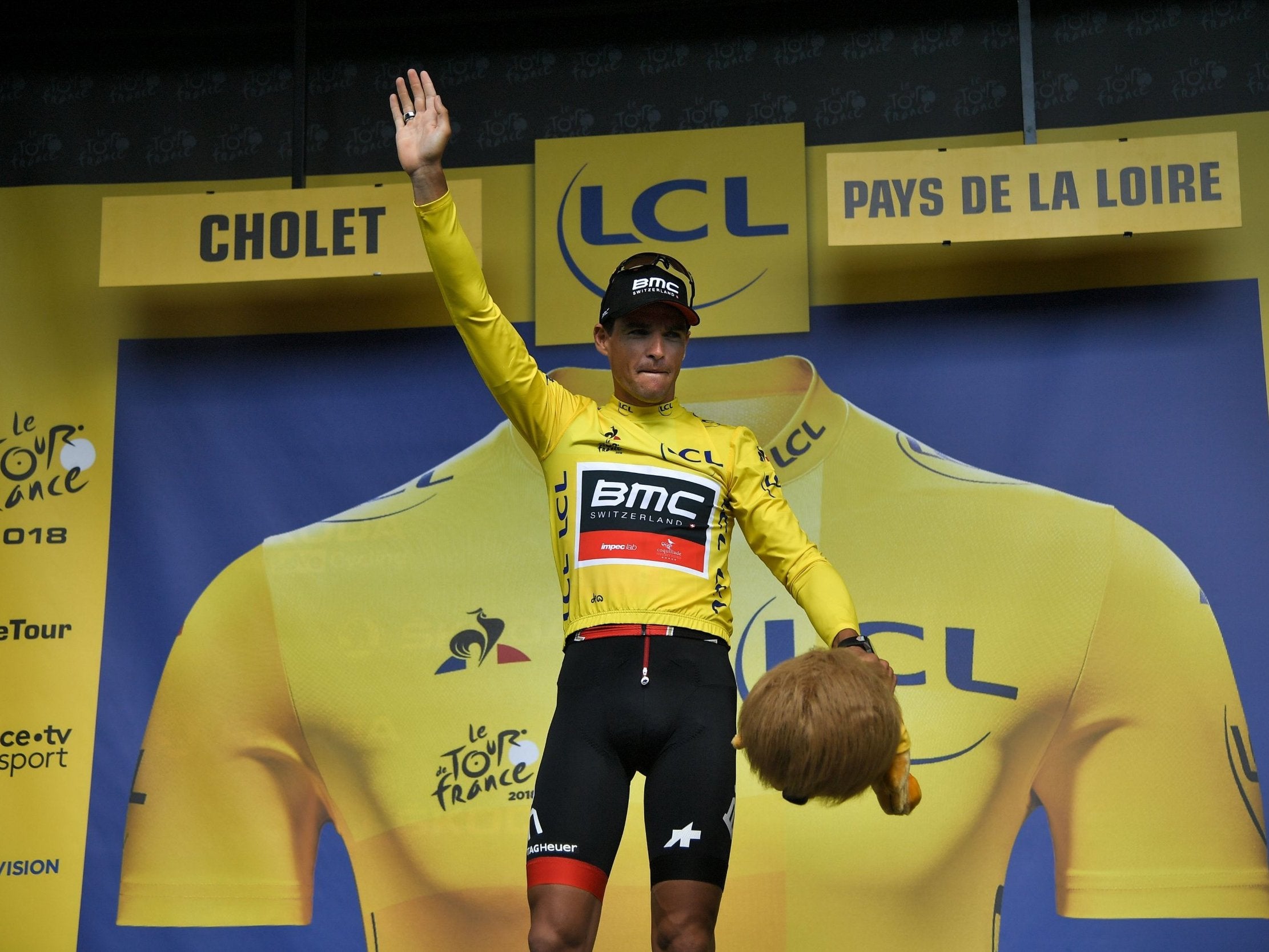 Greg van Avermaet celebrates claiming the yellow jersey