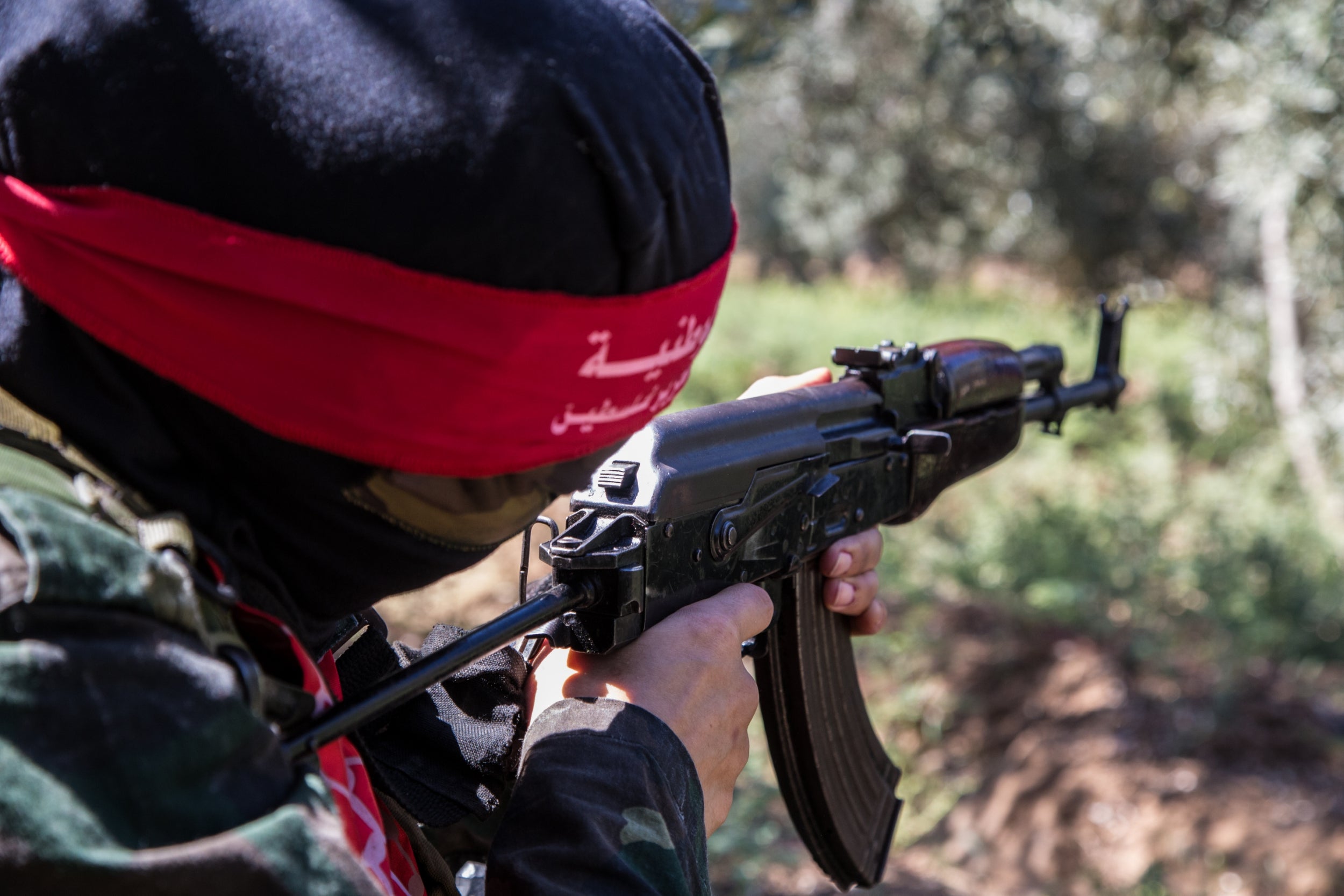 Gaza fighters training under the cover of olive trees to avoid detection by Israeli drones (Bel Trew/The Independent )